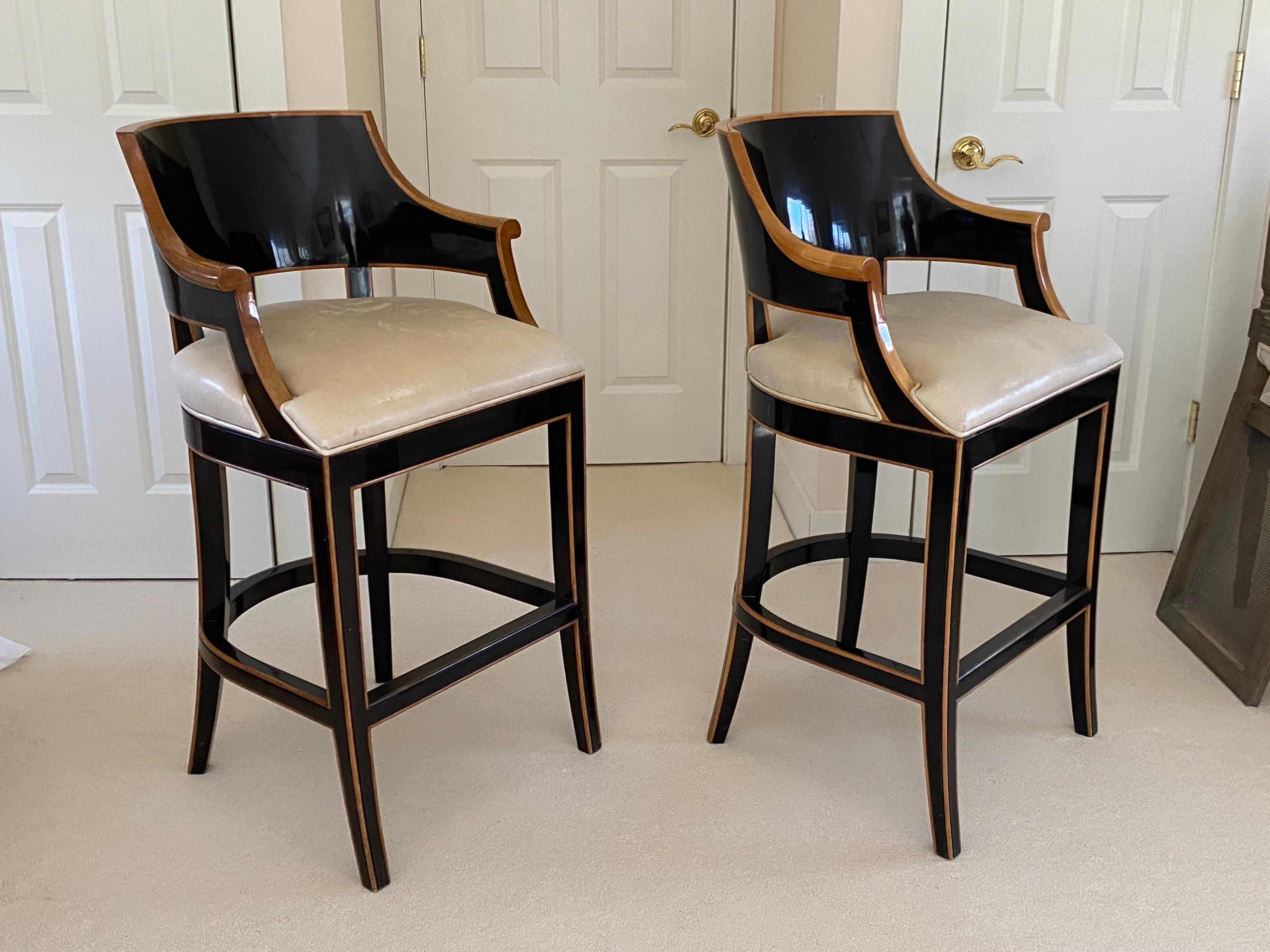 Pair of Gregorius Pineo 'Betty Bar Stool' in Light Walnut & Ebony Finishes.
An elegant pair of bar stools for a refined space. The warm light walnut finish contrasted with the ebony finish on walnut is gorgeous. The soft white leather on the seats