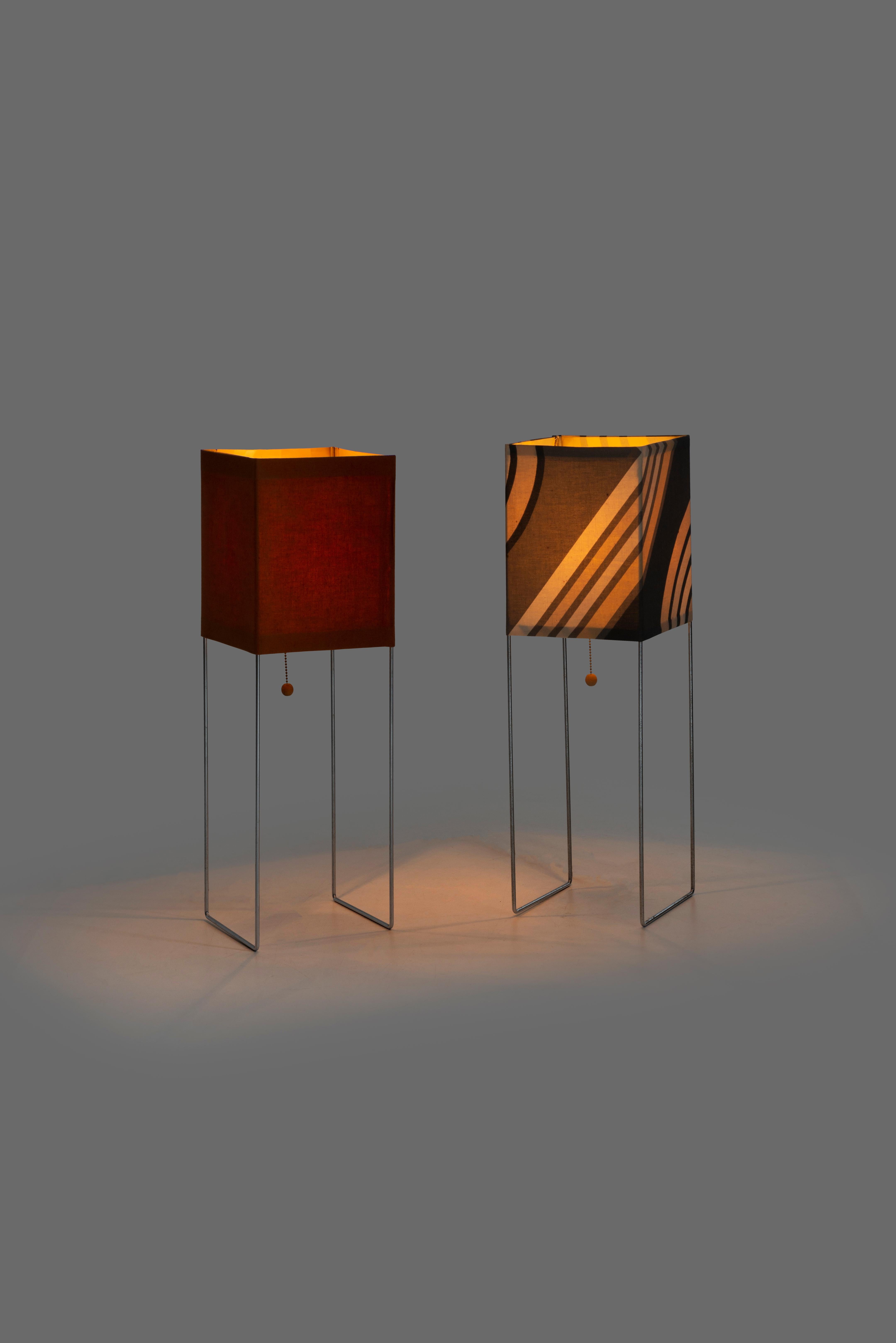 Pair of Gregory van Pelt wireworks lamps, chrome-plated steel, with original canvas shades.