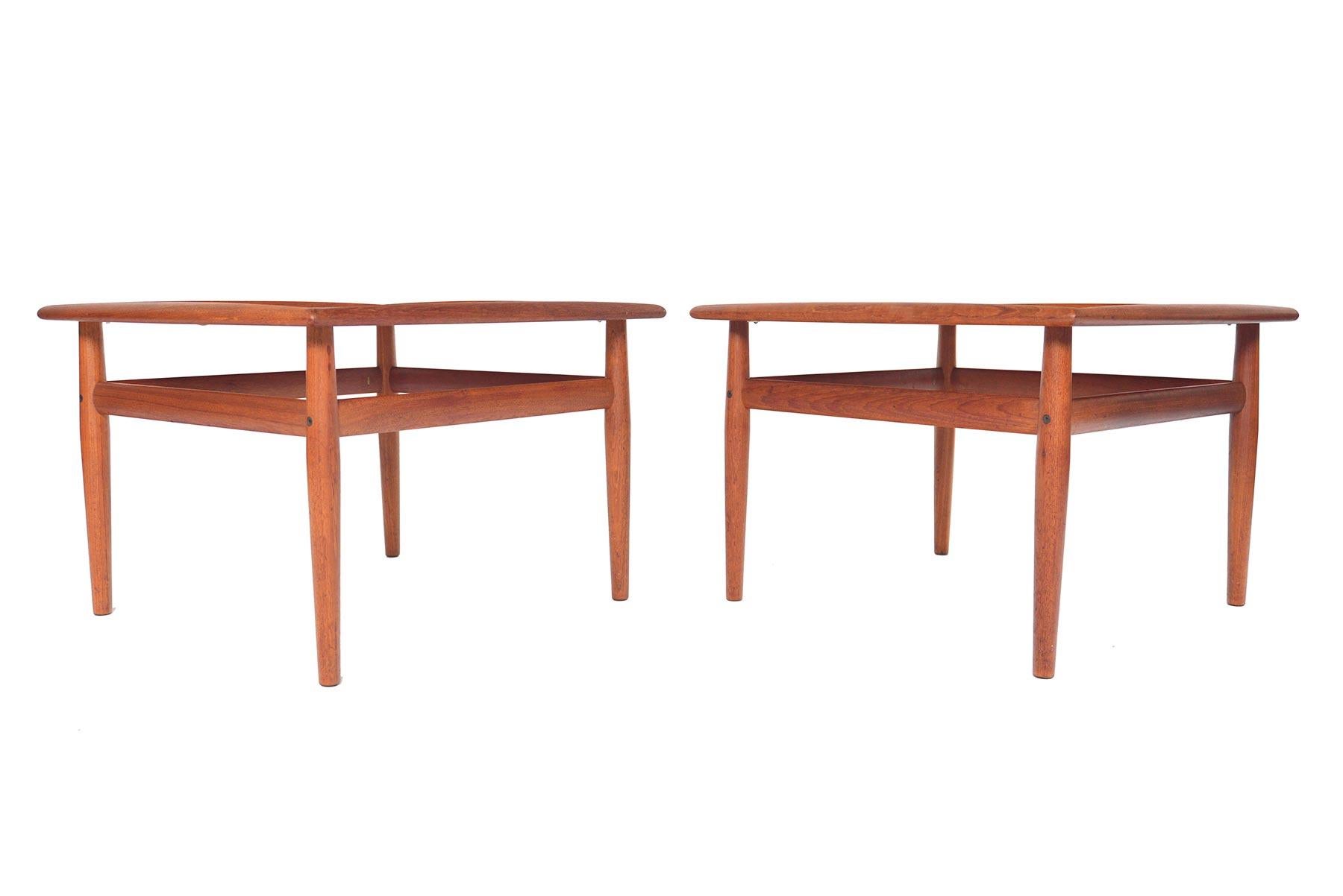 This pair of Danish modern teak side tables was designed by Grete Jalk for Glostrup Møbelfabrik in the early 1960s. Underneath the refined, handsome lines of these tables lies an extremely high level of skilled craftsmanship, which can be seen
