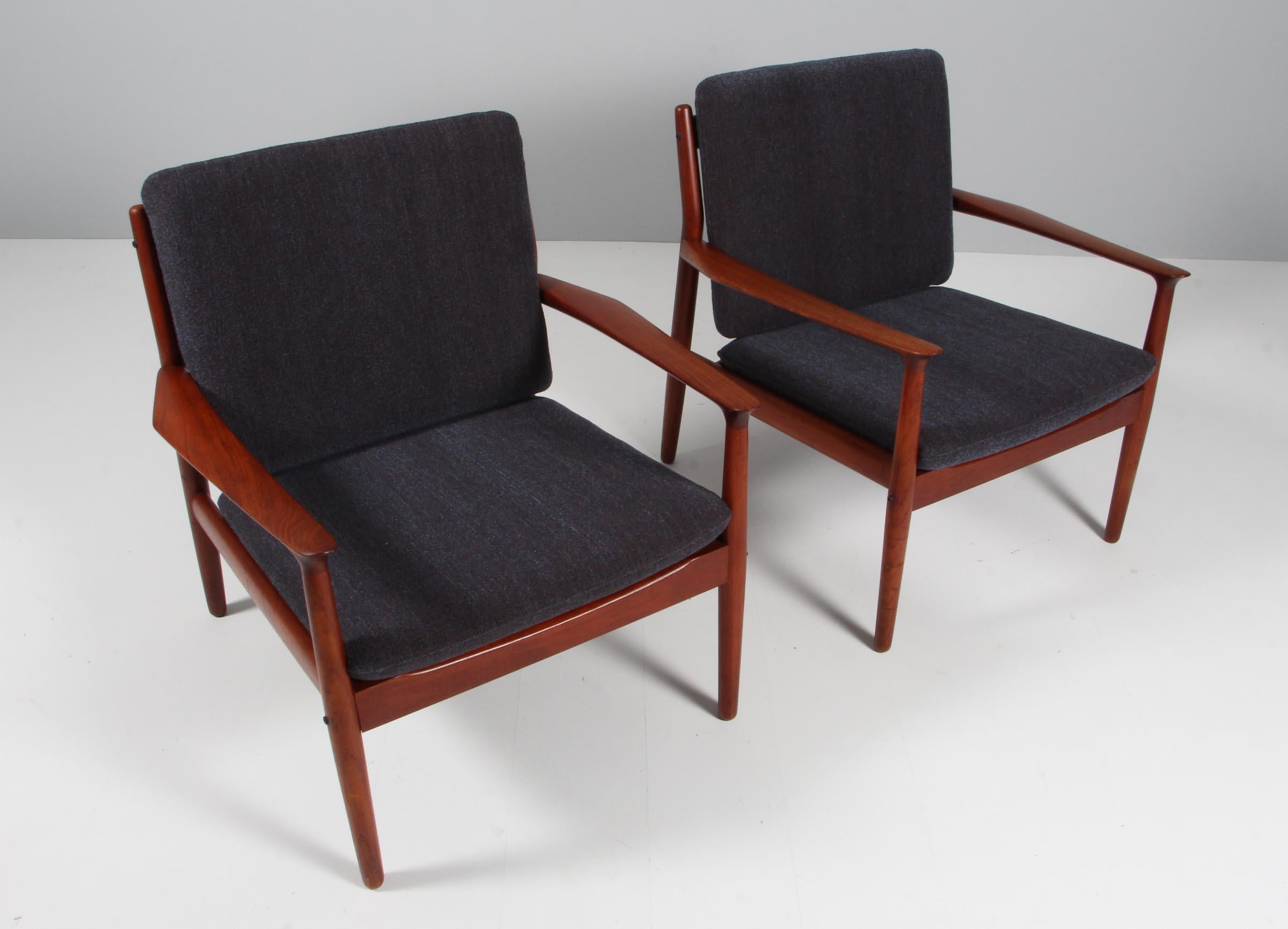 Pair of Grete Jalk armchairs in teak

New upholstered cushions with textured fabric.

Made by Poul Jeppesen.