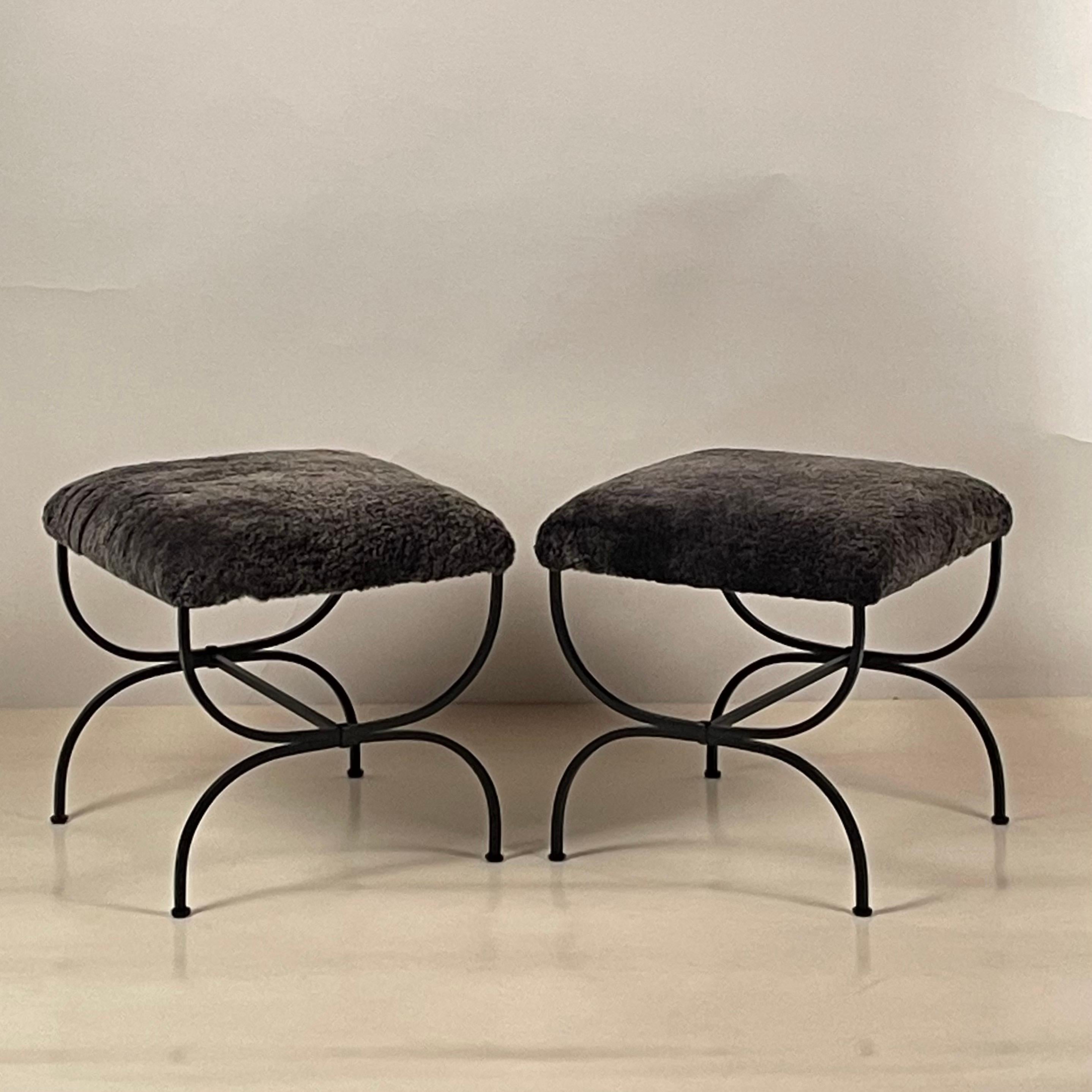 Pair of grey fur 'Strapontin' stools by Design Frères.

Chic and understated.