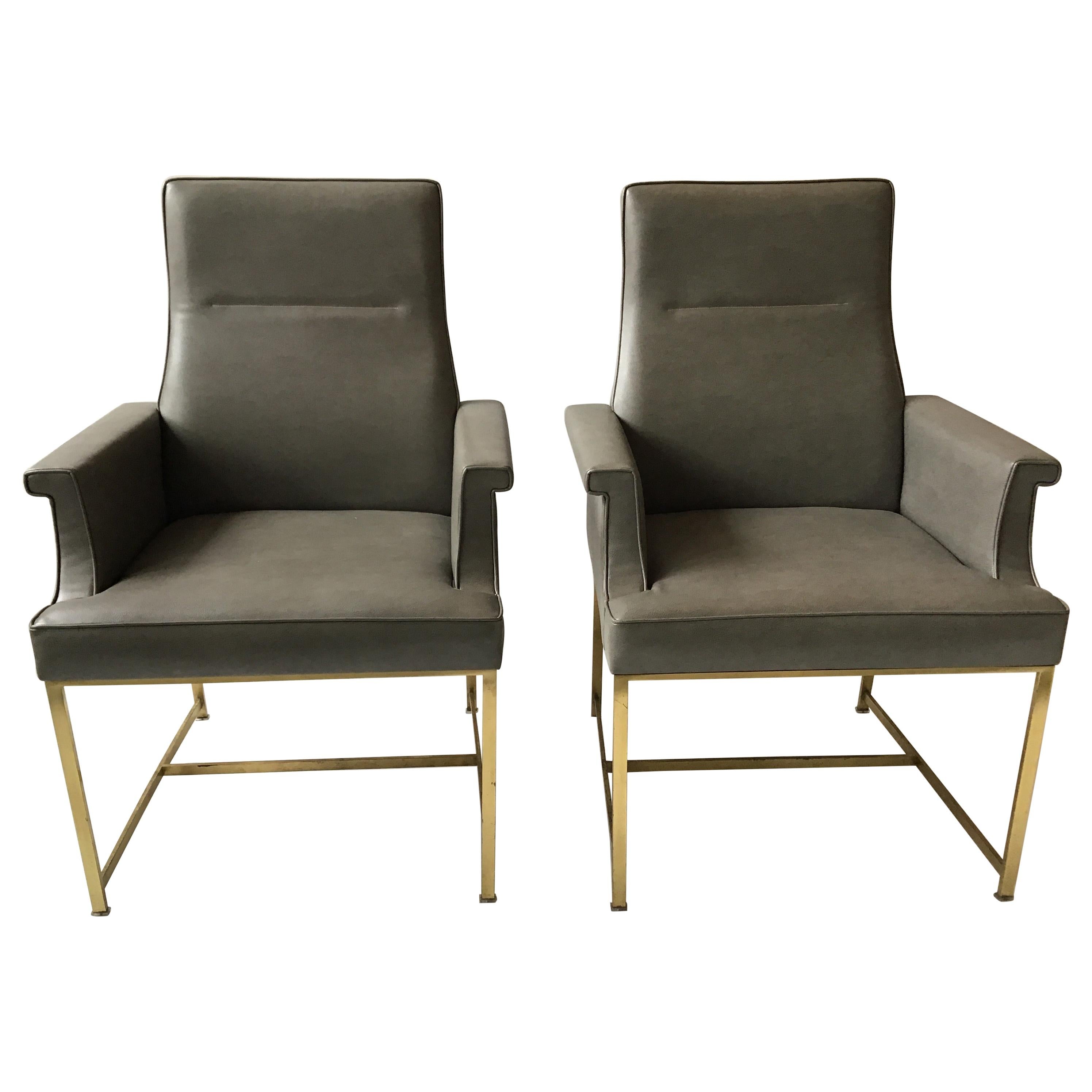 Pair of Grey Leather Armchairs on Brass Bases