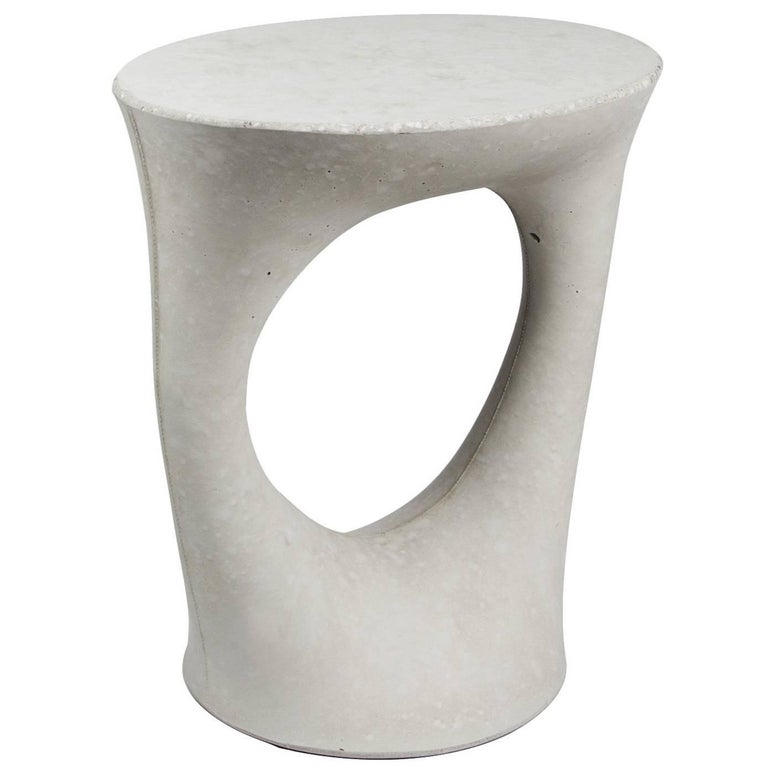 This listing is for a two tables in a light grey finish. 

Industrial, organic and sculptural, the Kreten side tables are concrete furniture like you haven’t seen before. Original pieces are created in Souda's Brooklyn studio by casting concrete