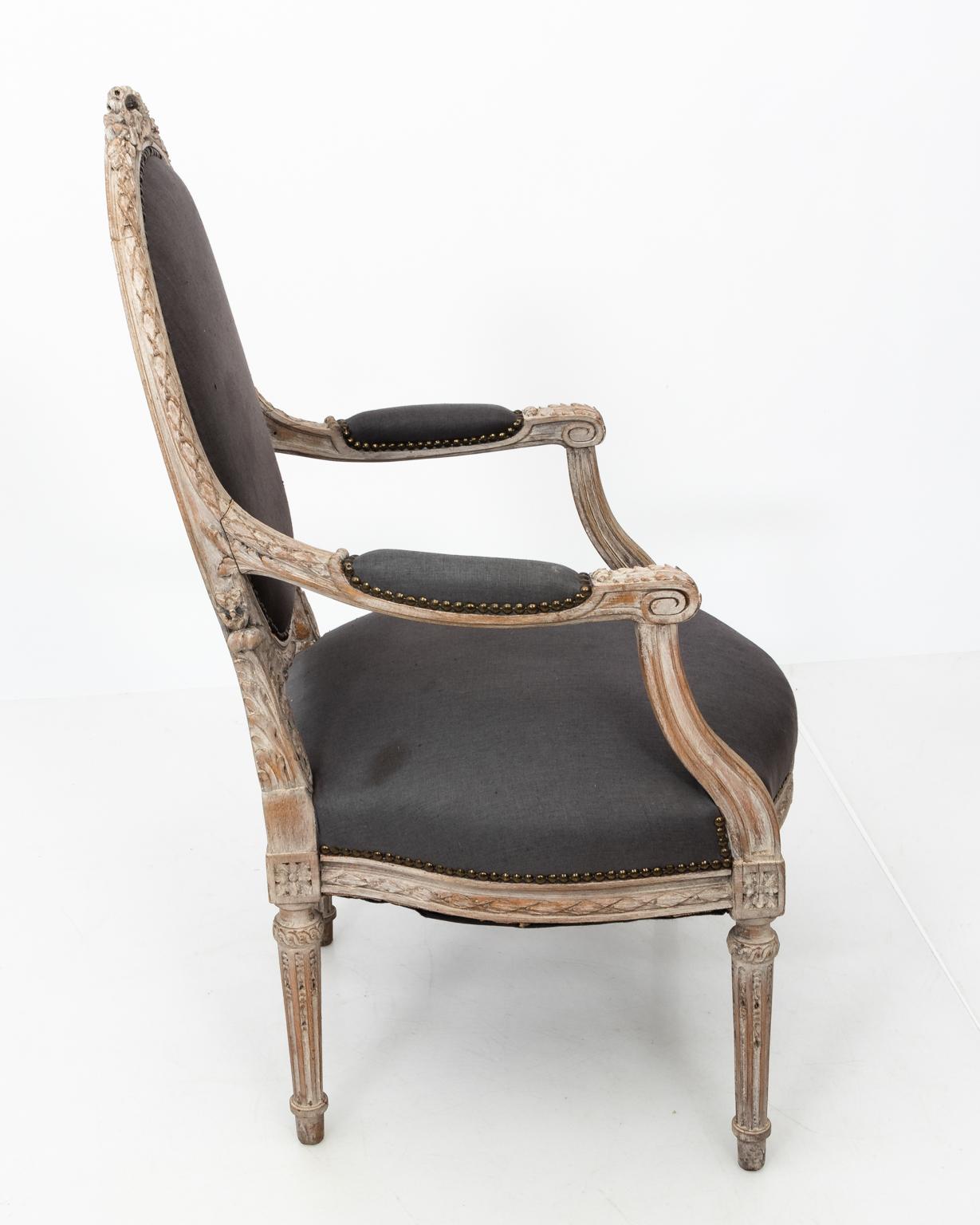 French Pair of Grey Upholstered Louis XVI Style Armchairs, circa 1820
