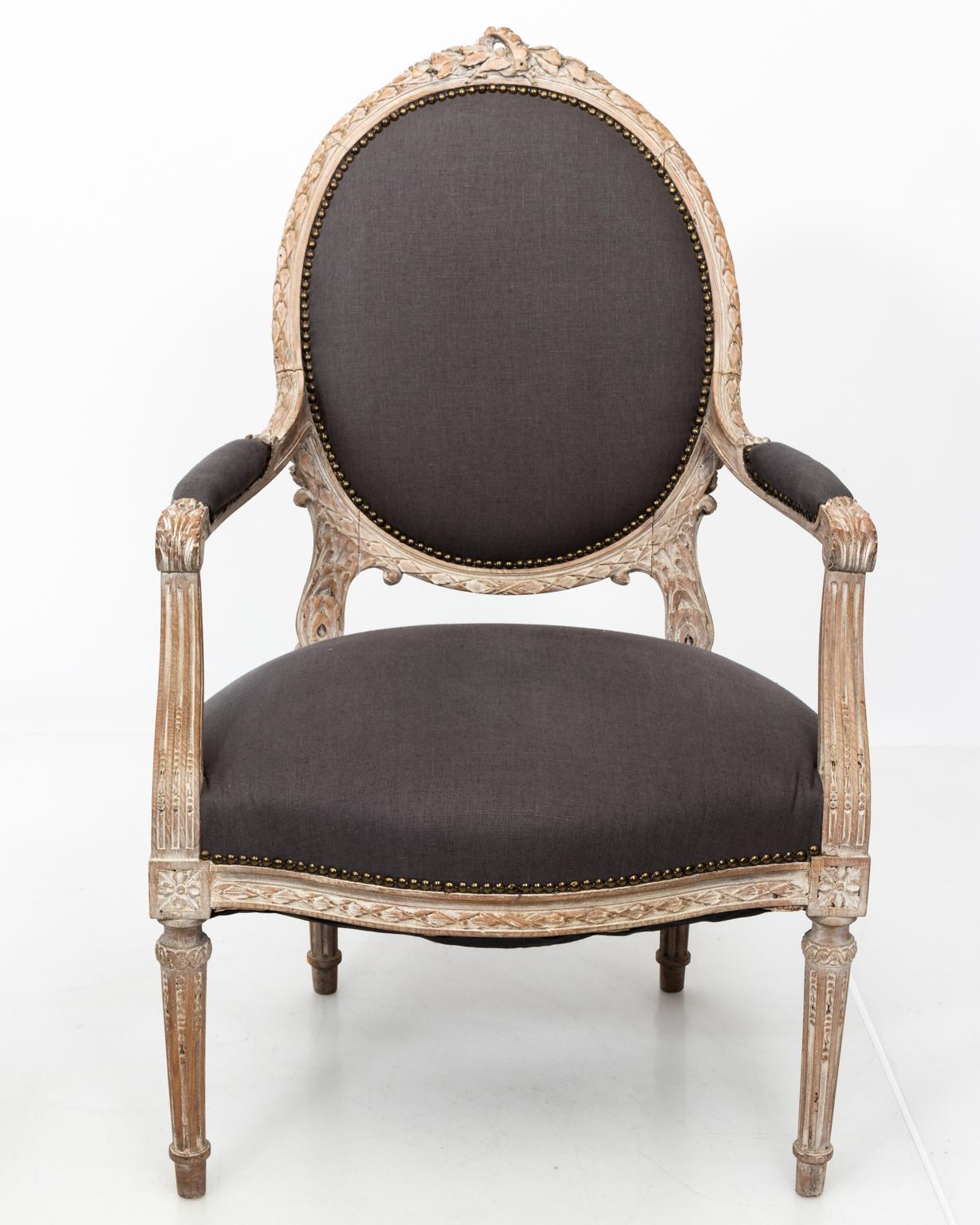 Wood Pair of Grey Upholstered Louis XVI Style Armchairs, circa 1820