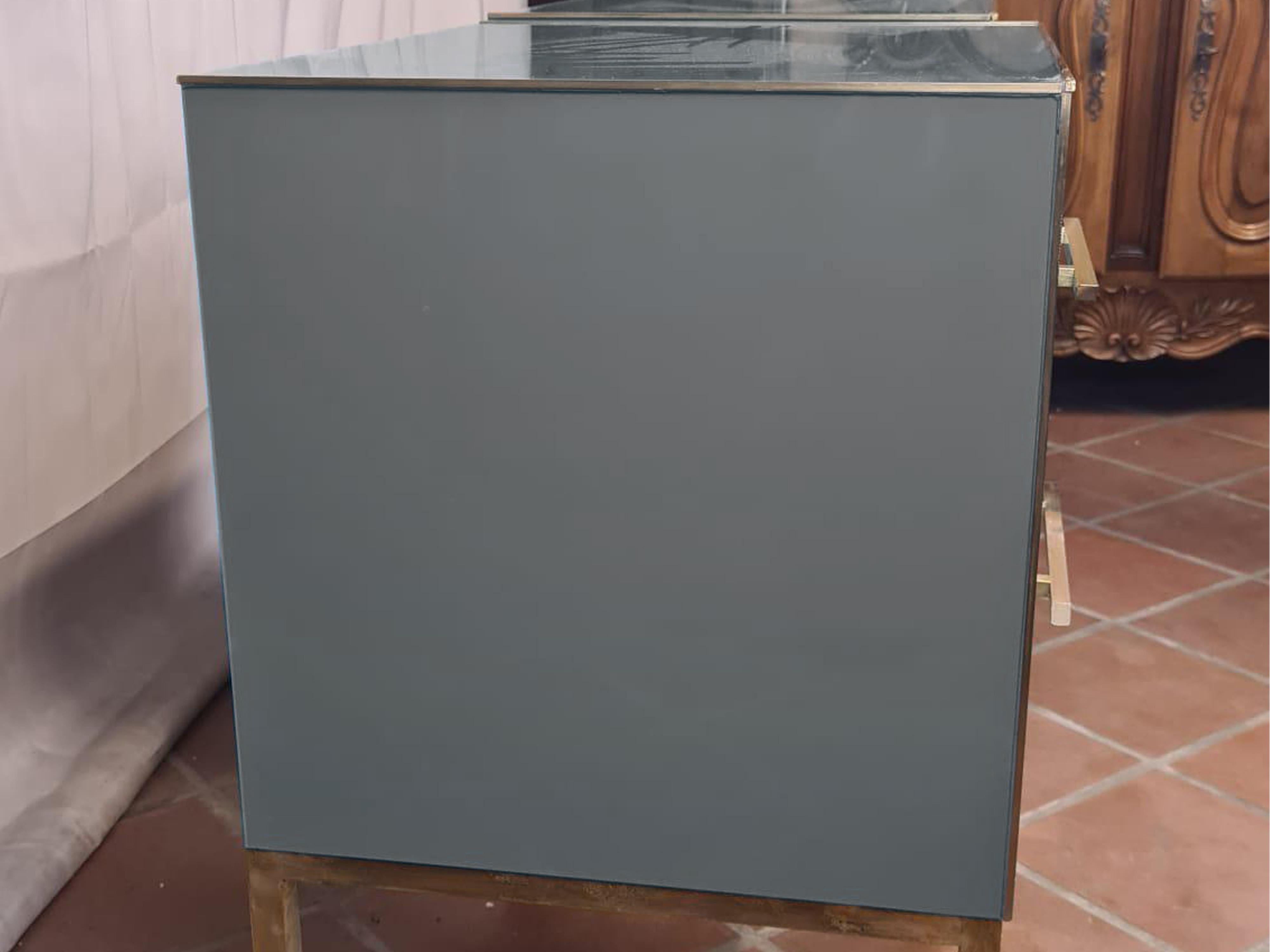 An exquisite pair of vintage Italian bedside tables, a testament to the elegance of Mid-Century Modern. 

Handcrafted in Italy, these anthracite-colored bedside tables display the timeless charm of Murano opaline glass tops and drawer fronts.