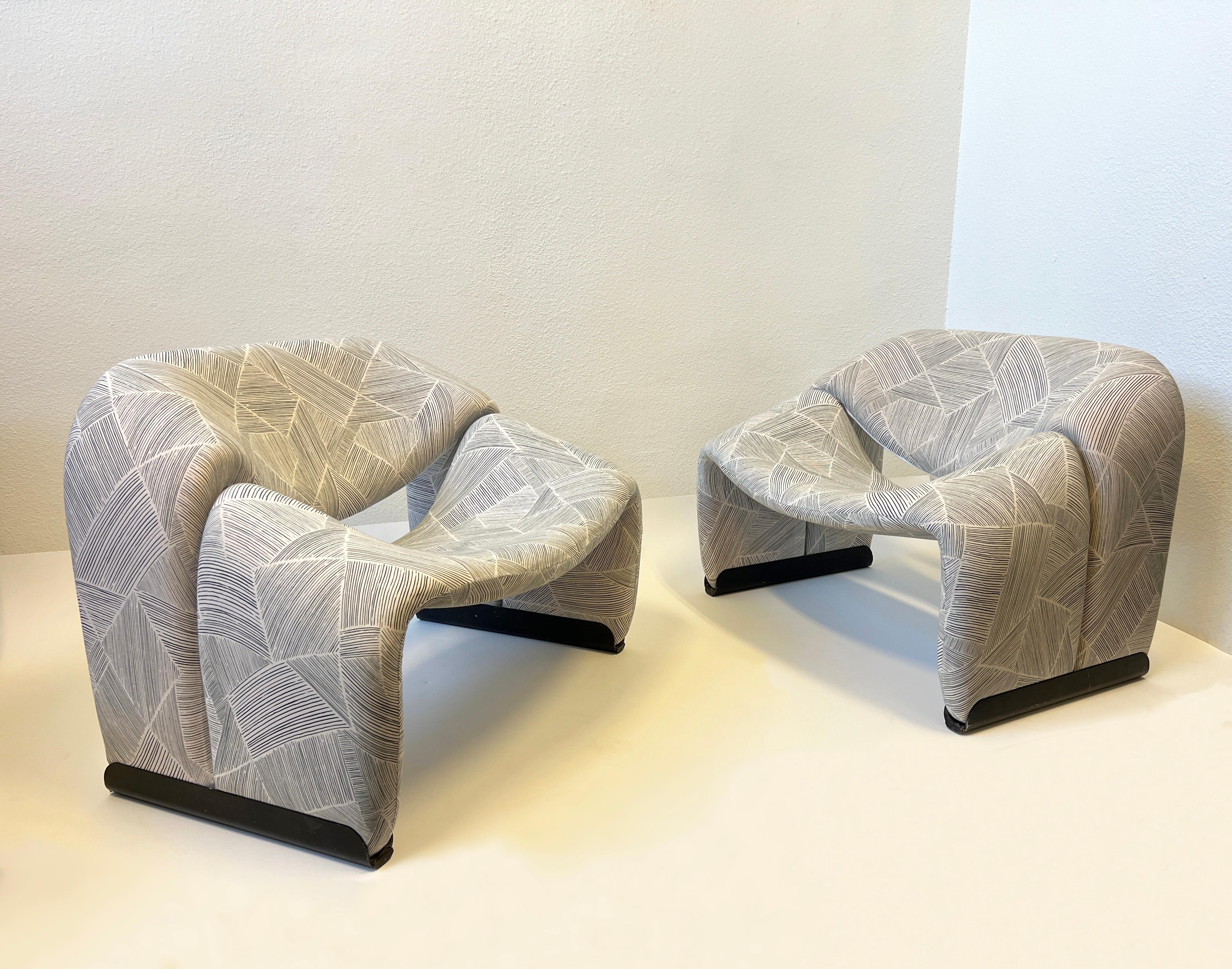 Pair of ‘Groovy’ lounge chairs designed in 1972 by Pierre Paulin.
Pair of Poufs by Vladimir Kagan are available in a separate listing. 
Newly upholstered in a soft stretch jersey. 
Measurements: 33” Wide, 25.5” Deep, 24.5” High, 14” Seat. 