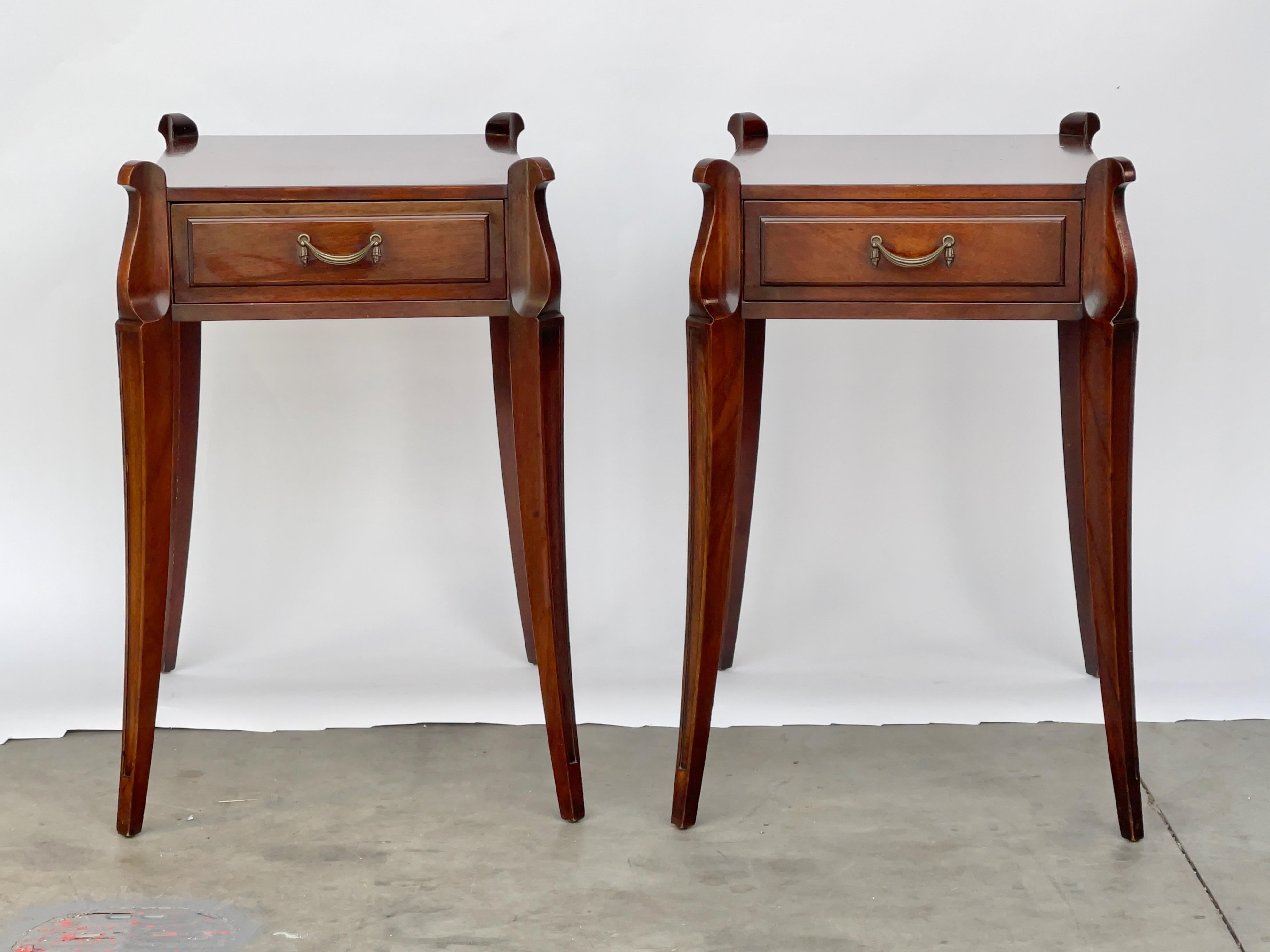 Pair of Grosfeld House no. 3726A mahogany end tables. 
Single drawer with bronze draped pull. 
False drawer on backside. 
Dimensions of rectangular top excluding legs is 27 inches by 16 inches.
Grosfeld House produced highly stylish designs