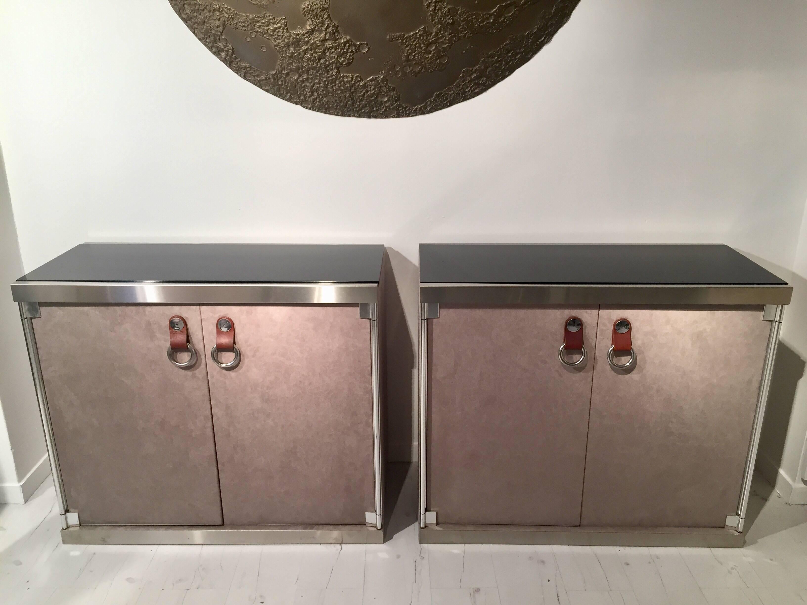 Pair of 1970s cabinets with suede look, leather handles and black lacquered top.
This cabinets were retailed By Hermes in 1970s-1980s.
Chromed steel details.
Perfect condition.