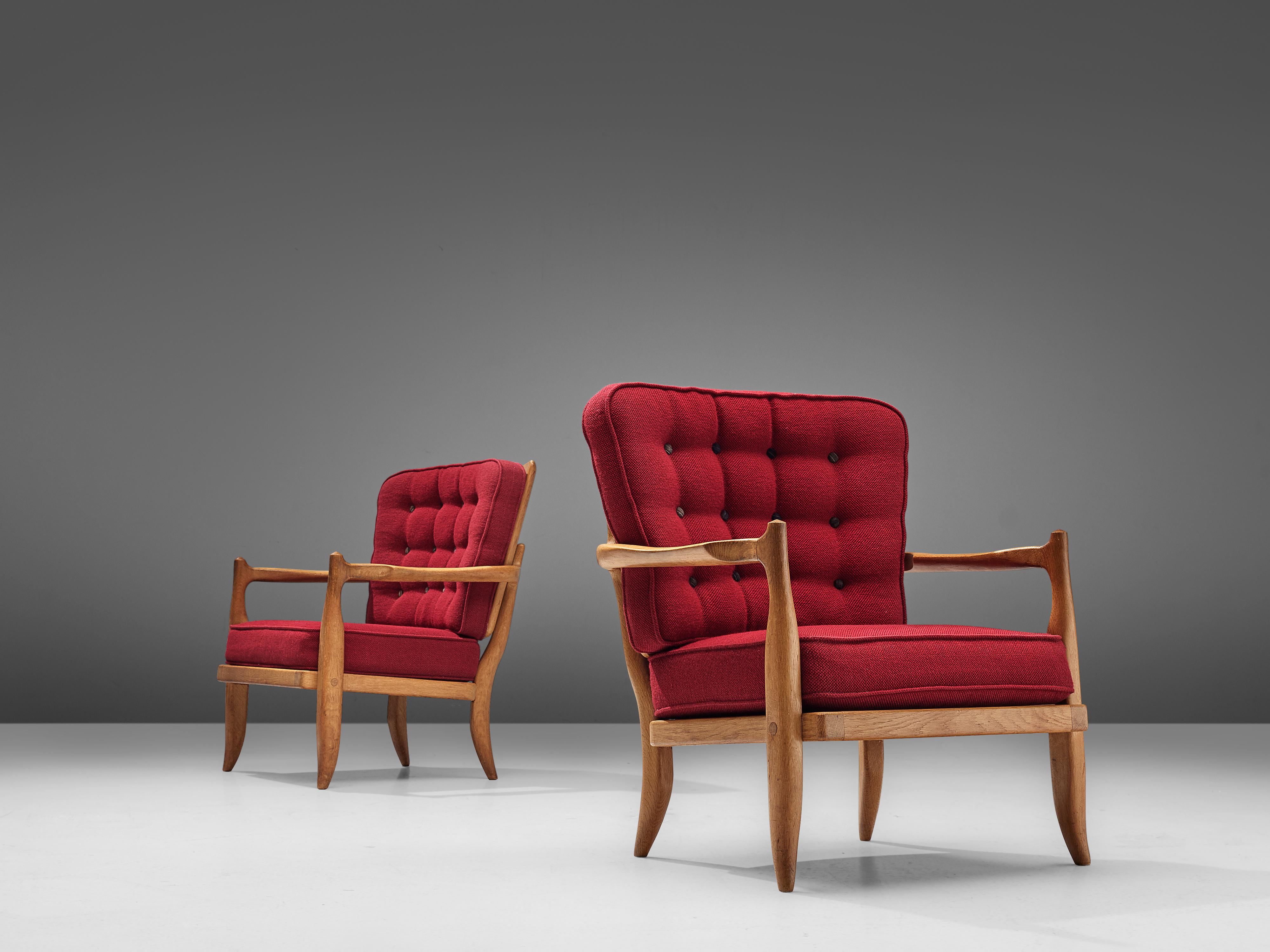 Guillerme and Chambron, set of two easy chairs, model 'José', oak, red upholstery, France, 1950s

Characteristic pair of lounge chairs by French designer duo Guillerme et Chambron. The seating as well as the backrest are made of comfortable
