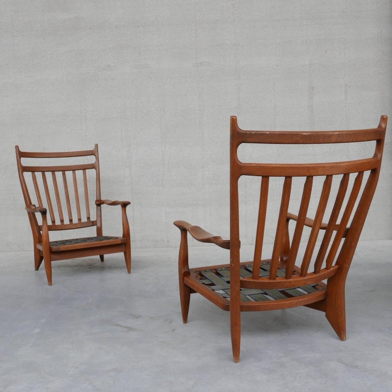 A pair of oak Guillerme et Chambron armchairs. 

France, c1960s., 

'Edouard' Model. 

The frames remain in good condition. 

Original upholstery wants updating, priced accordingly. 

Location: Belgium Gallery. 

Dimensions: 66 W x 67 D