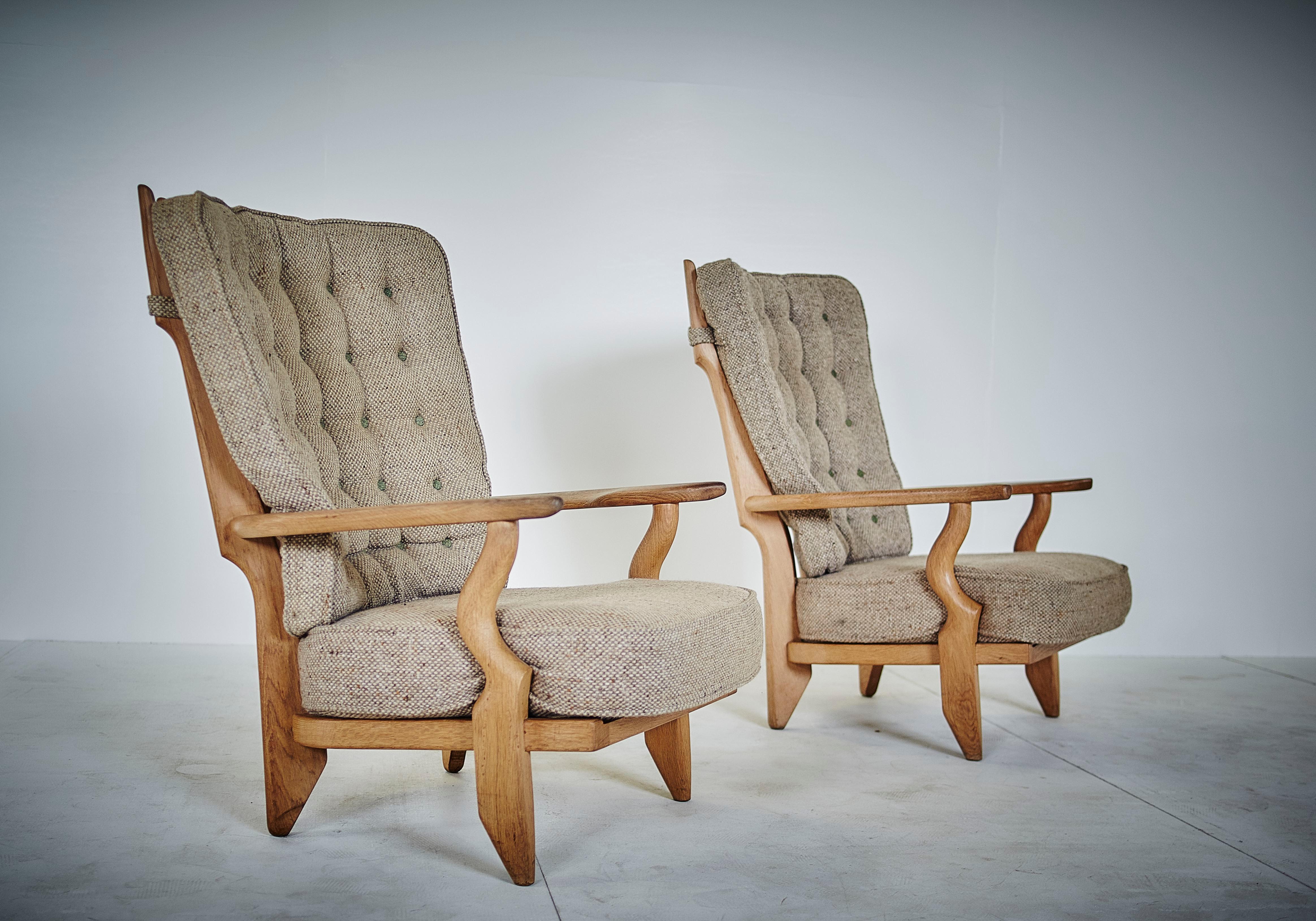 Rare pair of grand repos model by Guillerme et Chambron with original fabric.

The duo is known for their high-quality solid oak furniture.

Robert Guillerme (1913-1990) and Jacques Chambron, (1914-2001).
Their company, Votre Maison, has marked