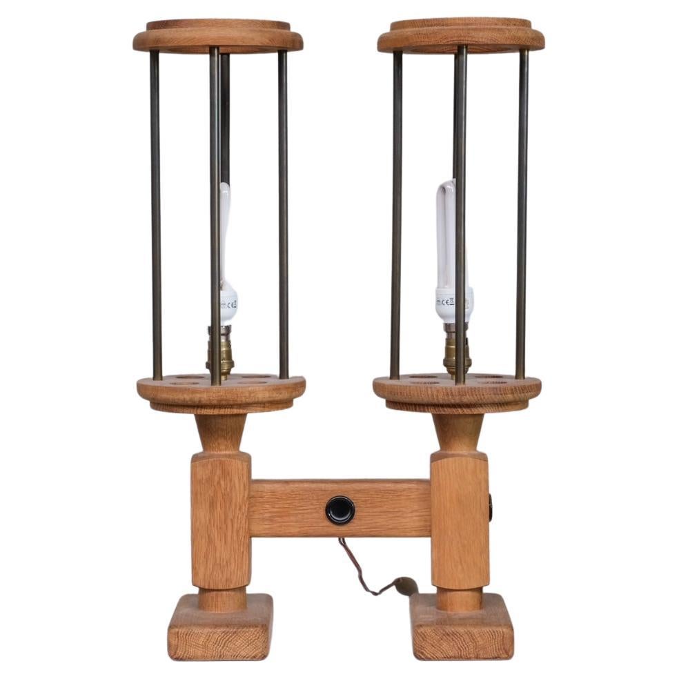 A pair of mid-20th oak table lamps. 

By esteemed designers Guillerme et Chambron. 

France, c1960s. 

Oak and metal. 

Price is for the pair. 

Since re-wired and PAT tested.

Location: Belgium Gallery. 

Dimensions: 73 H x 33 W x 18