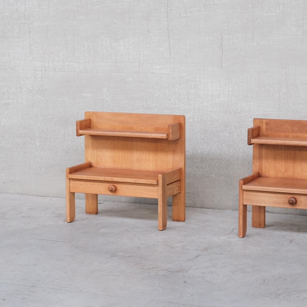 A pair of oak bedside tables by esteemed designers Guillerme et Chambron. 

France, c1960s. 

Single drawer to each, with a single shelf. 

Good condition, lightly restored. 

Location: Belgium Gallery.

Dimensions: 32 D x 59 W x 58 Height