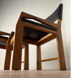 Pair of Guillerme et Chambron oak and leather chairs