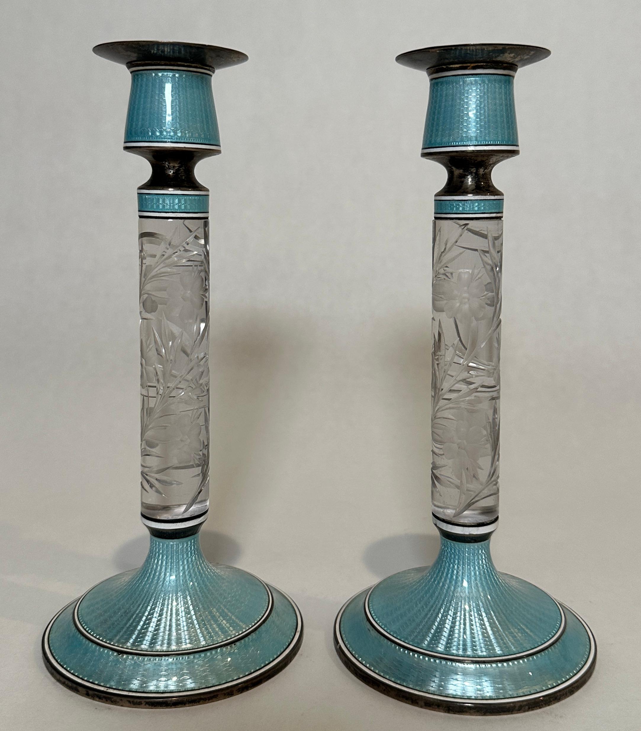 Fine tall pair of blue guilloche enamel sterling silver candle holders. Marked Sterling with additional hallmarks. Floral cut glass columns mounted top and bottom with sterling and guilloche enamel.