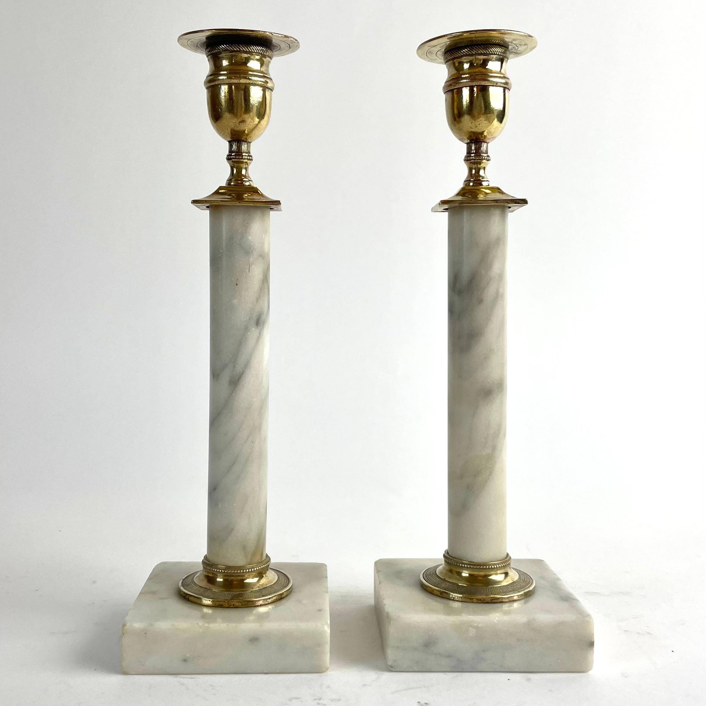 
Pair of Gustavian Candlesticks in Carrara Marble and Brass, Late 18th Century

An elegant pair of late Gustavian (Swedish Neoclassical) candlesticks, crafted in Carrara marble with finely detailed brass mounts. Dating from the late 18th century to