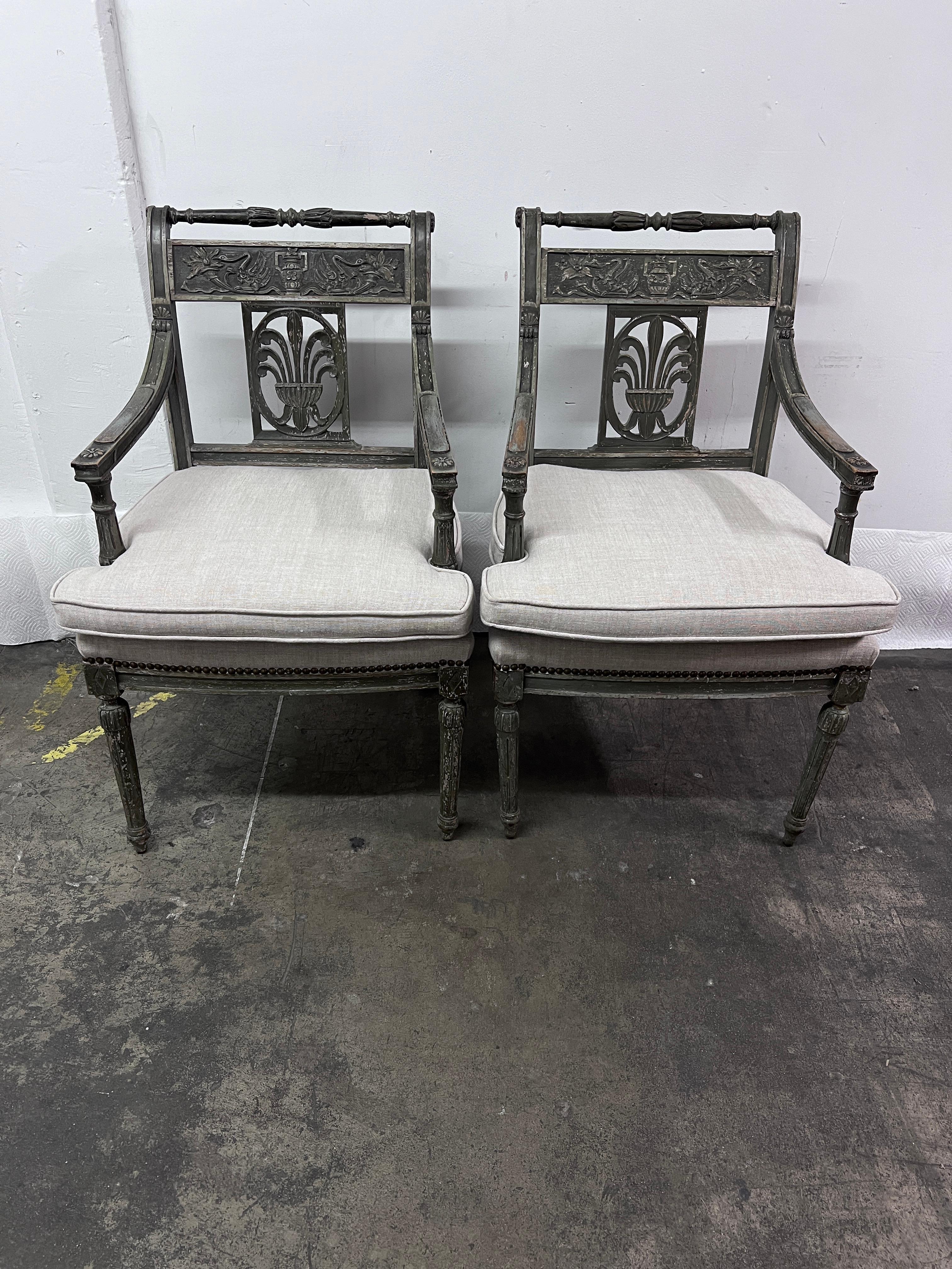 A beautiful pari of Late 18th C., Early 19th C., Swedish Gustavian Chairs.

The Swedish Grey patination is perfection and the attention to detail, carving and design represent the era and classic design.  Upholstered in a fine linen - all in very