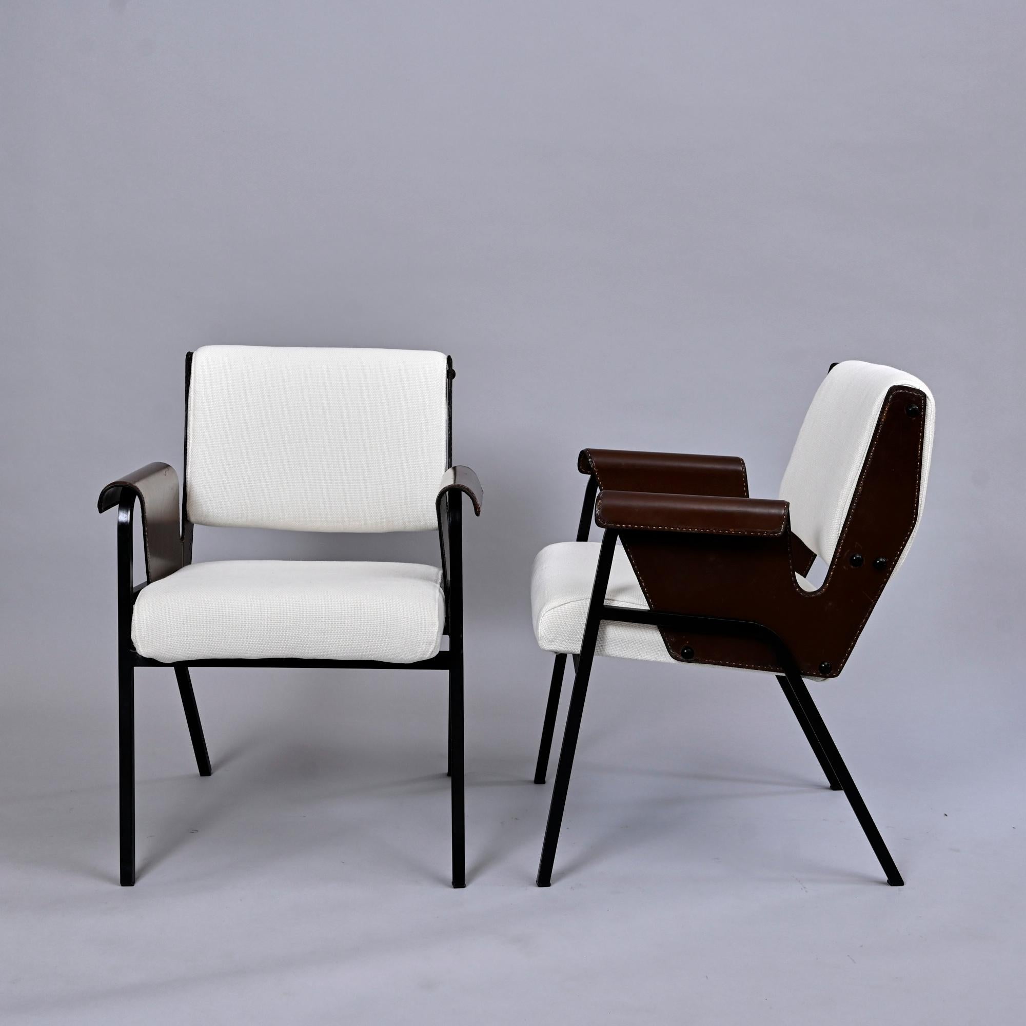 The 'Albanega' armchairs were designed for the San Marco motor vessel in Italy in 1955 by Gustavo Pulizer.

Stitched leather, enamelled steel, upholstery.

These have been reupholstered.