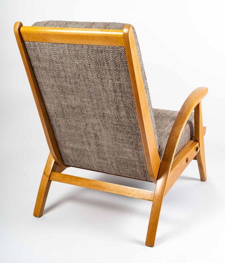 Rare pair of system armchairs, modernist and dynamic structure in solid oak, by guy besnard, freespan edition, france 1950. 

Light oak structure, with openwork armrest and high back.
The seat and backrest have been completely restored.
The