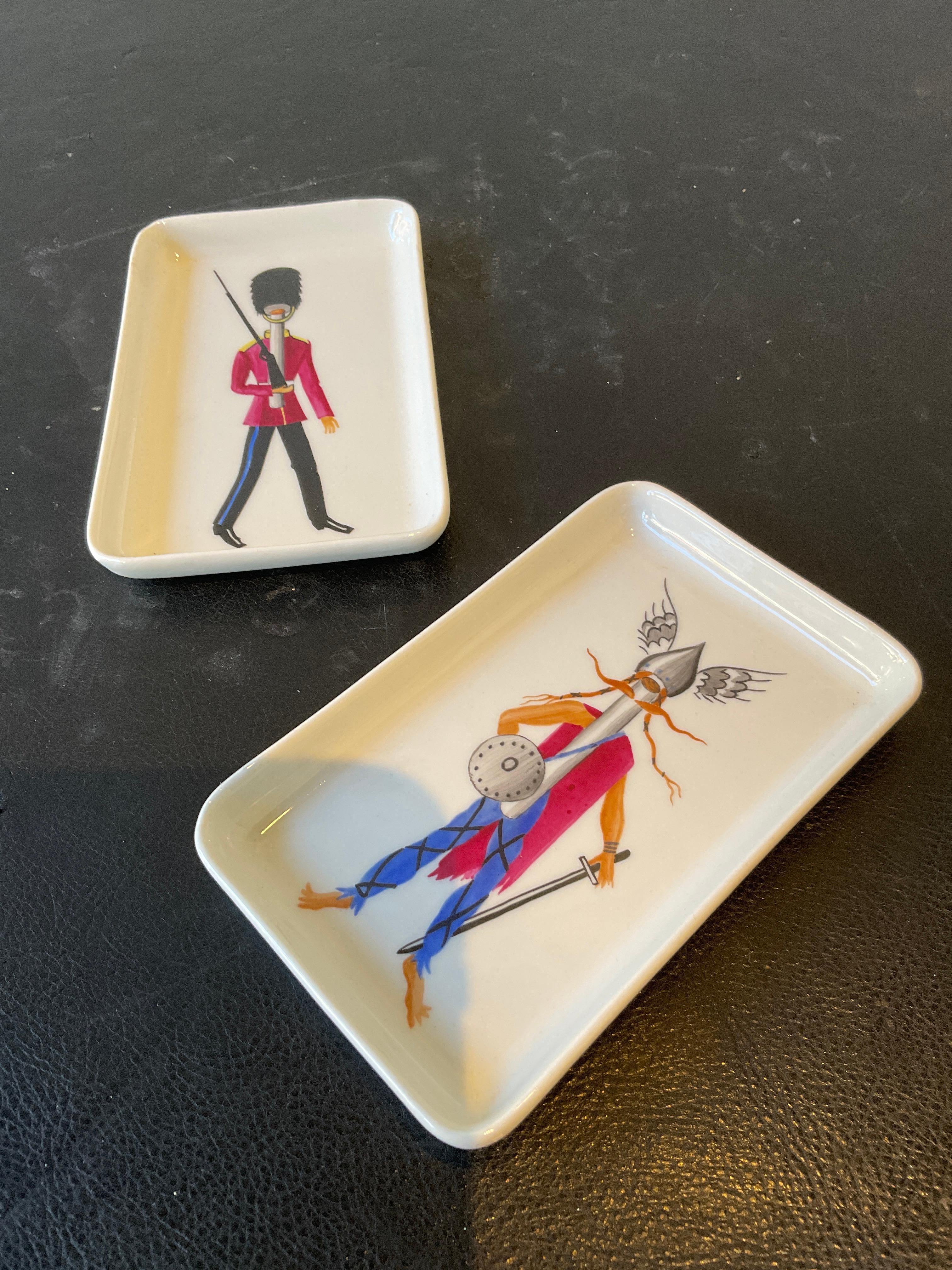 Pair of Guy Thirion Decor Main Paris Limoges trays of a Viking and a British guardsman.