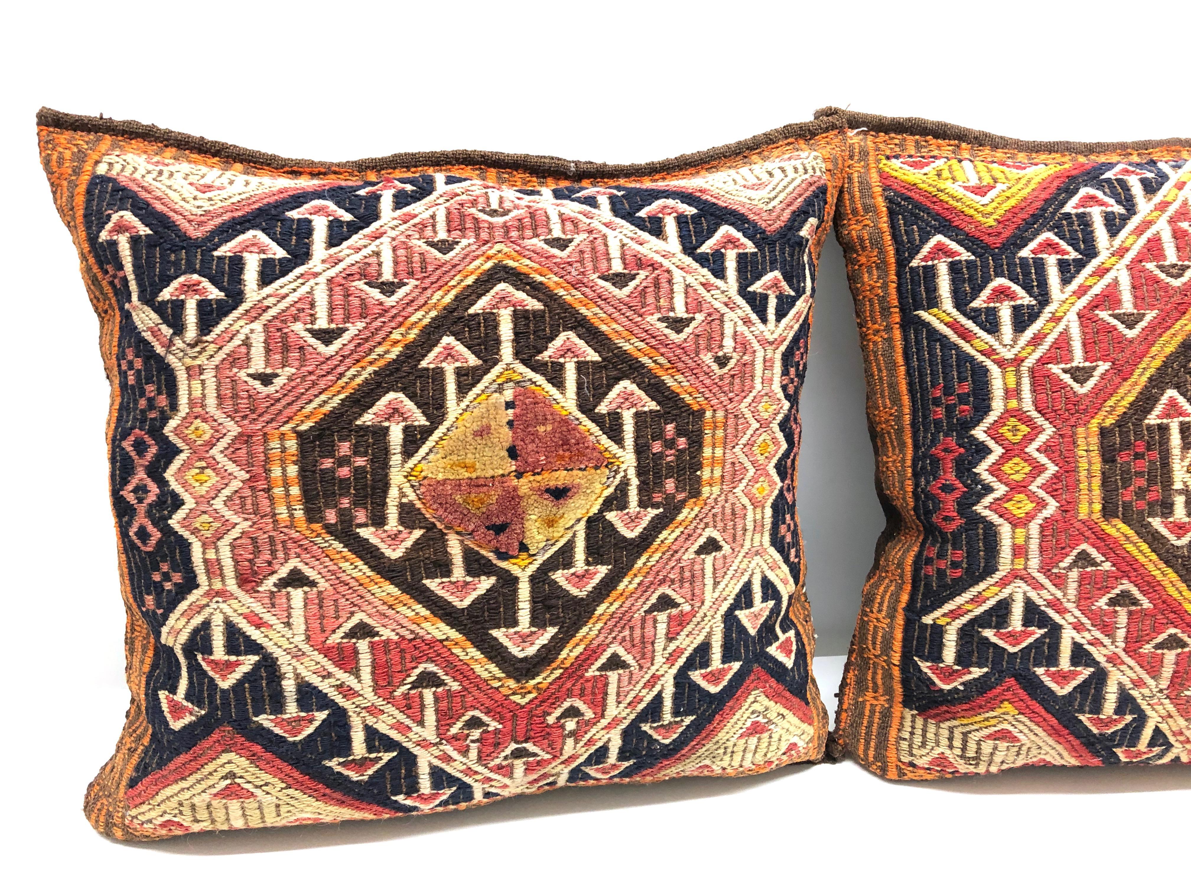 Gorgeous pair of oriental pillows. Handmade of woolen salt bags or oriental rug. Each measures approximate 17 inch high, is approximate 15 at the widest point and about 6 inch deep.