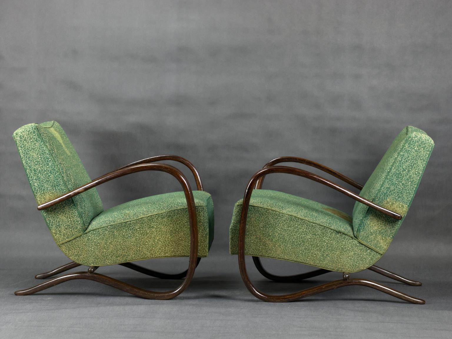 Pair of iconic H-269 lounge chairs by Jindrich Halabala for Up Závody Brno in good, original condition. The upholstery is faded and stained but the chairs are structurally in good condition.
Czechoslovakia, 1930s.
 