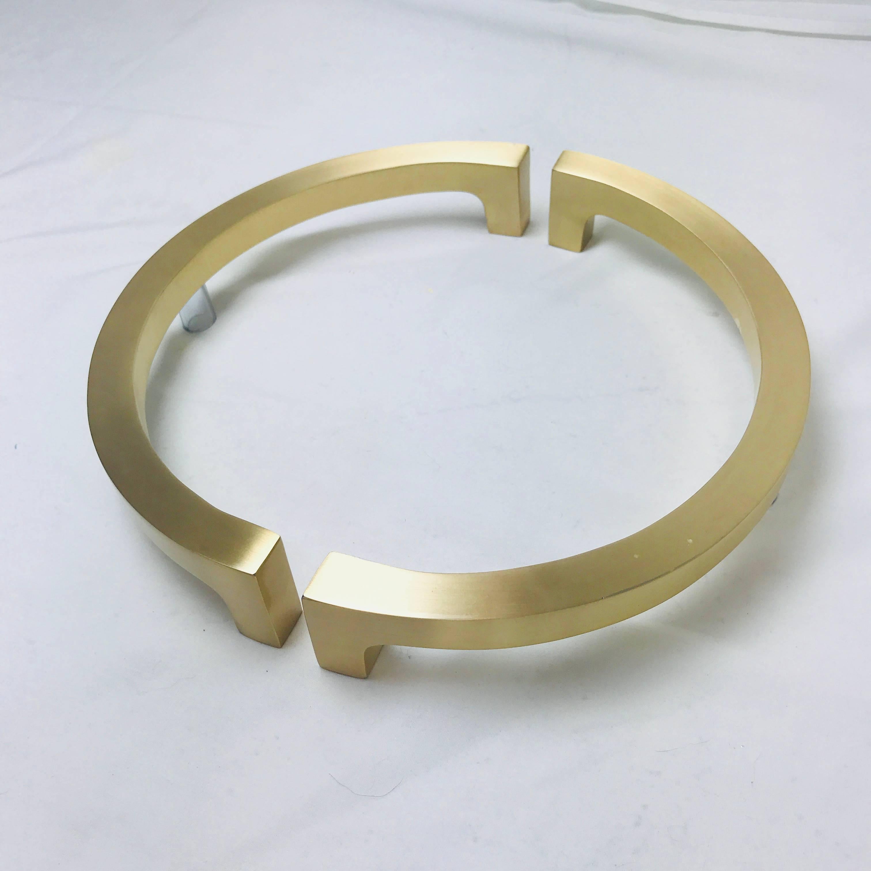 Pair of half circular brass entry door pulls. Cast brass with lacquer finish. Very heavy and substantial. Handles are made to be placed as half circles on opposite sides of door, but could be placed side by side on double exterior doors. Interior