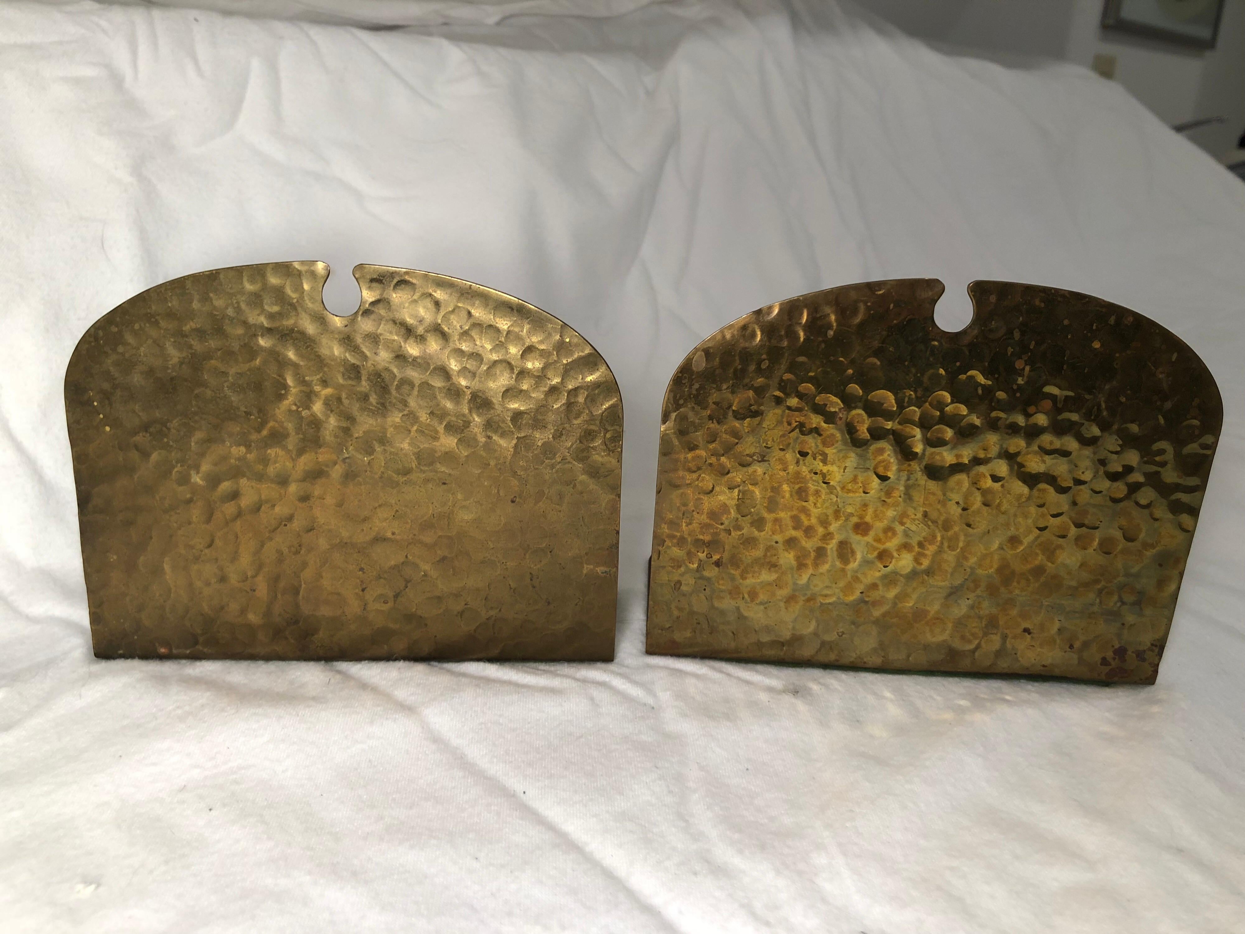 Pair of hammered brass Arts and Crafts bookends by Frost . The perfect addition to an Arts and crafts library. Copper plated brass. Green felt bottom.