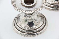 Pair of hammered silver piano candlesticks