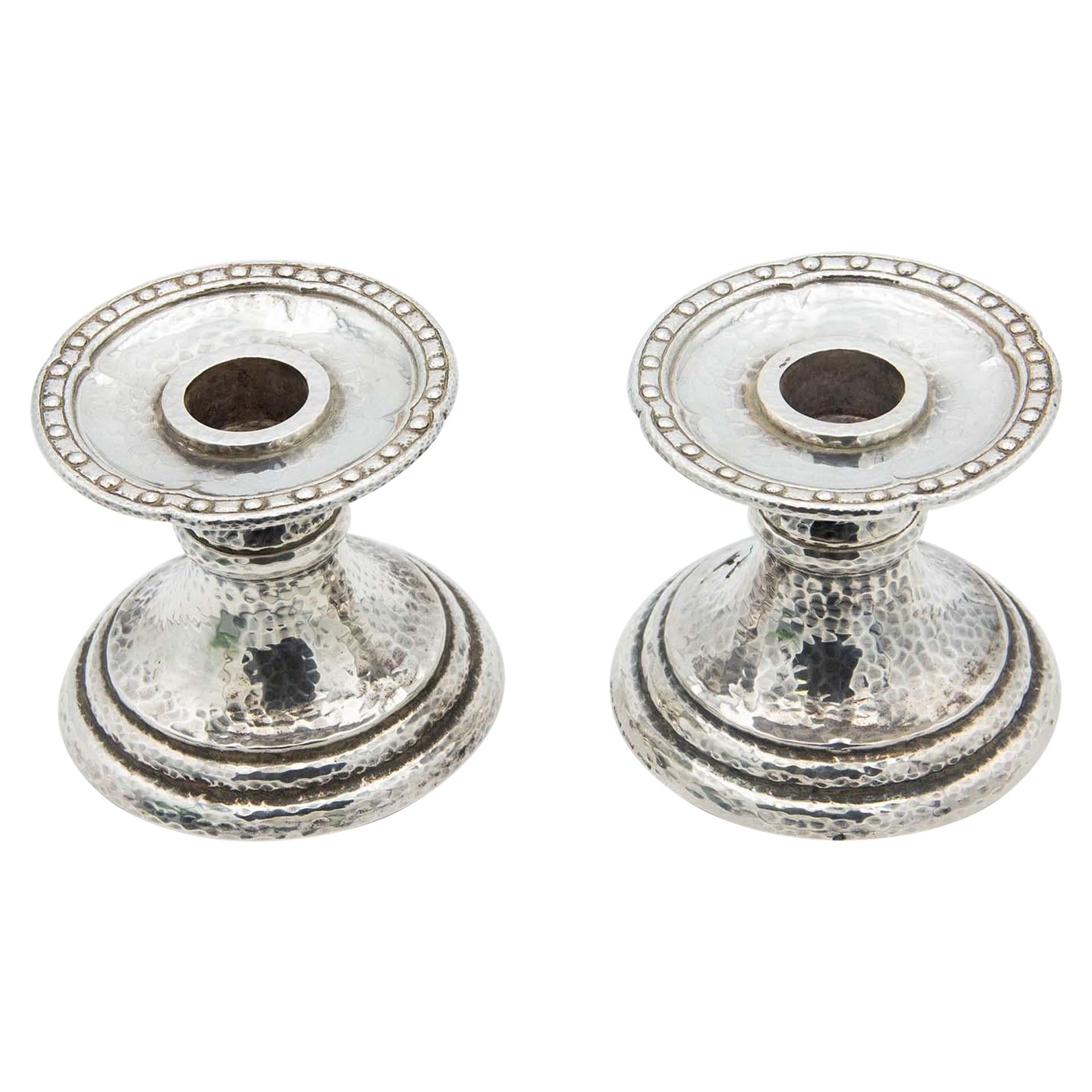 Pair of hammered silver piano candlesticks For Sale