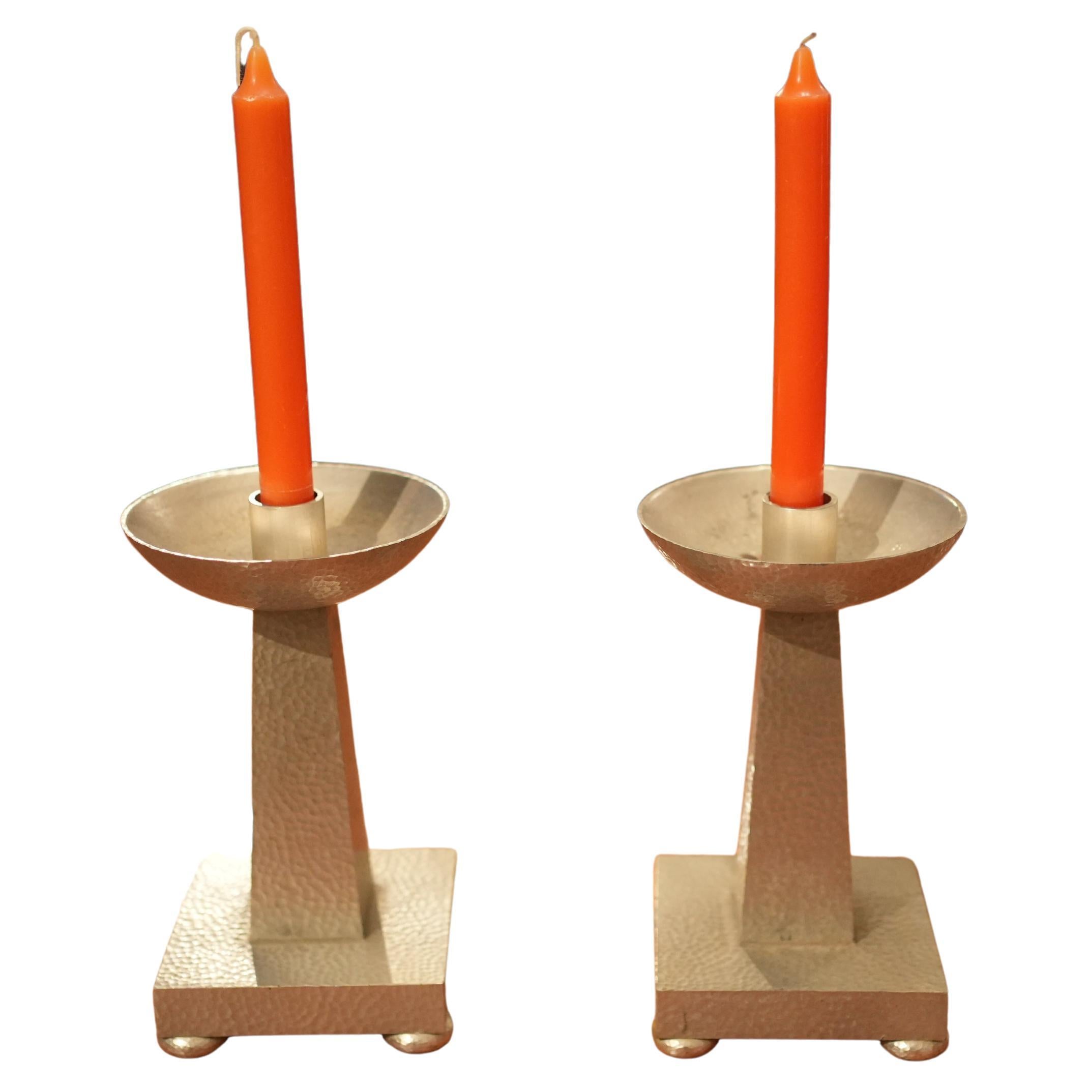 Pair of hammered steel candlesticks im Angebot