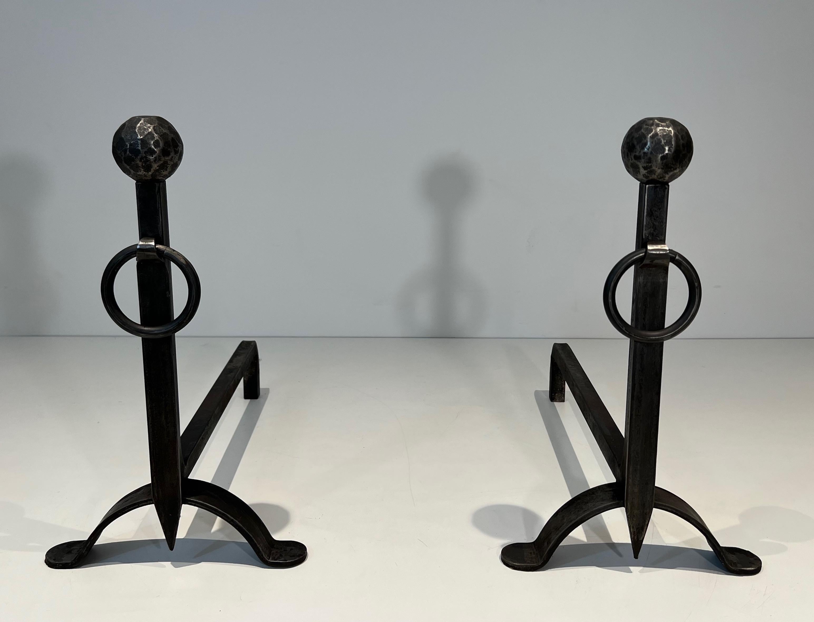 This pair of andirons is made of hammered wrought iron. This is a French Work. Circa 1950