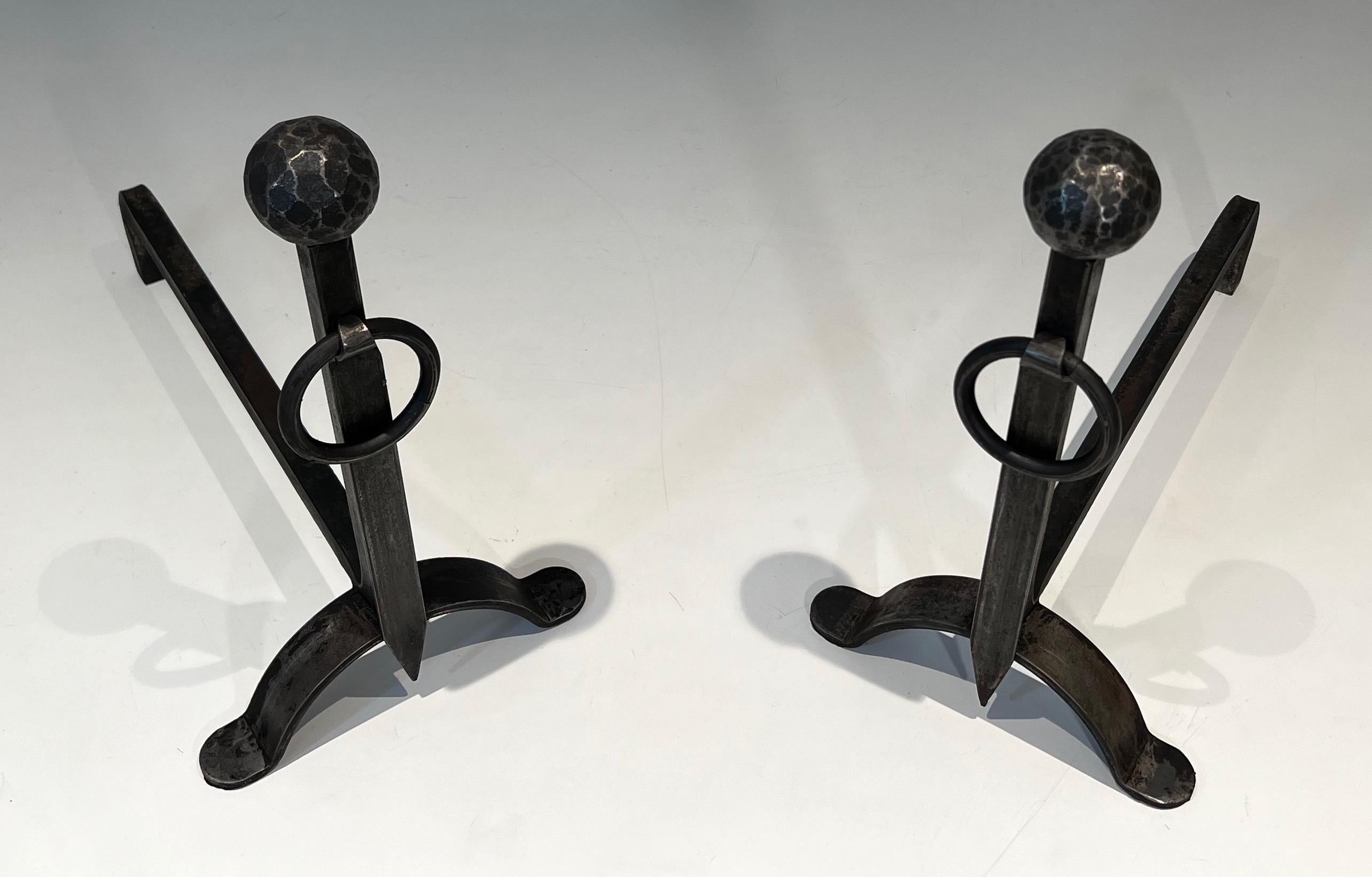 Mid-Century Modern Pair of hammered wrought iron andirons. French Work. Circa 1950 For Sale