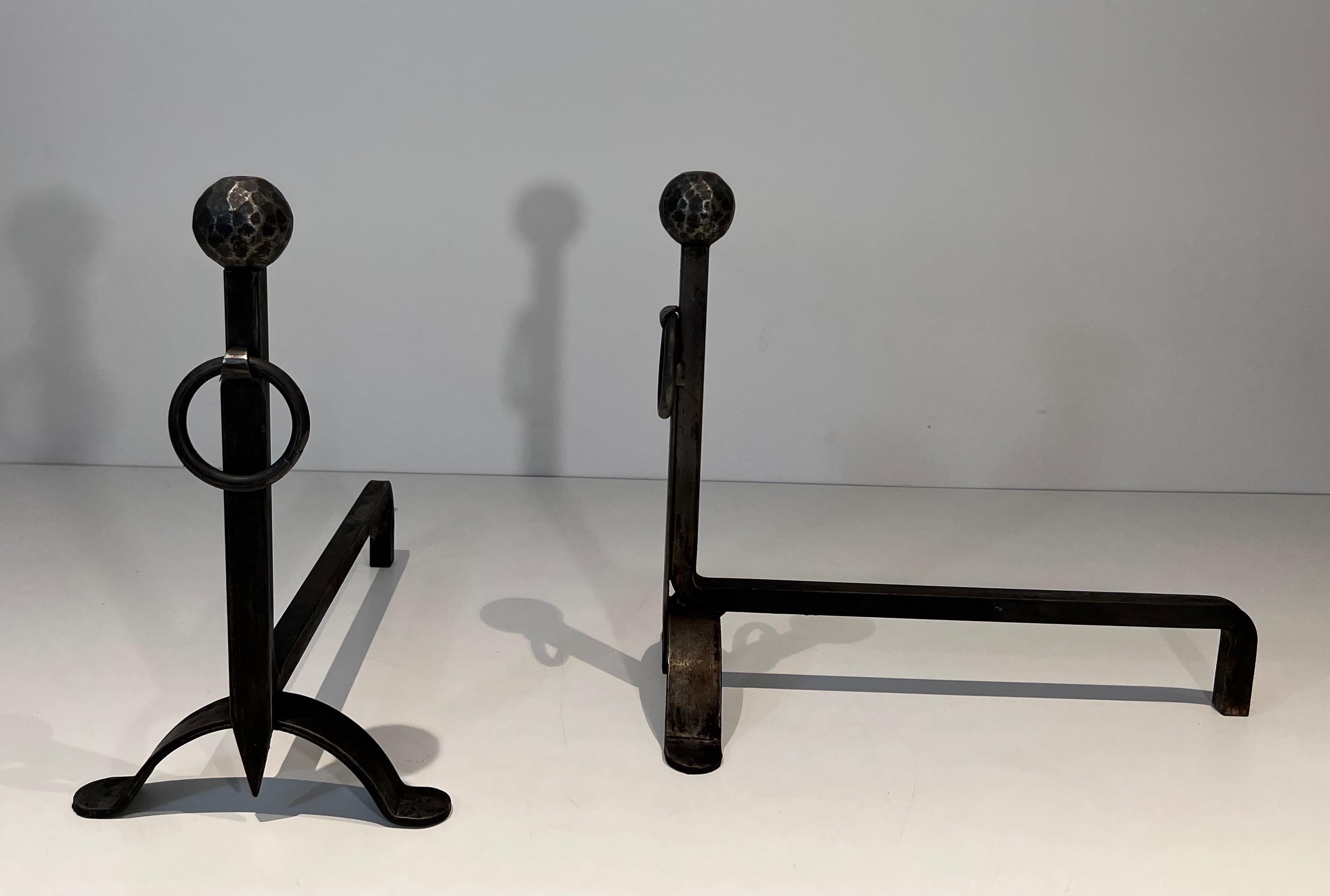 Mid-20th Century Pair of hammered wrought iron andirons. French Work. Circa 1950 For Sale