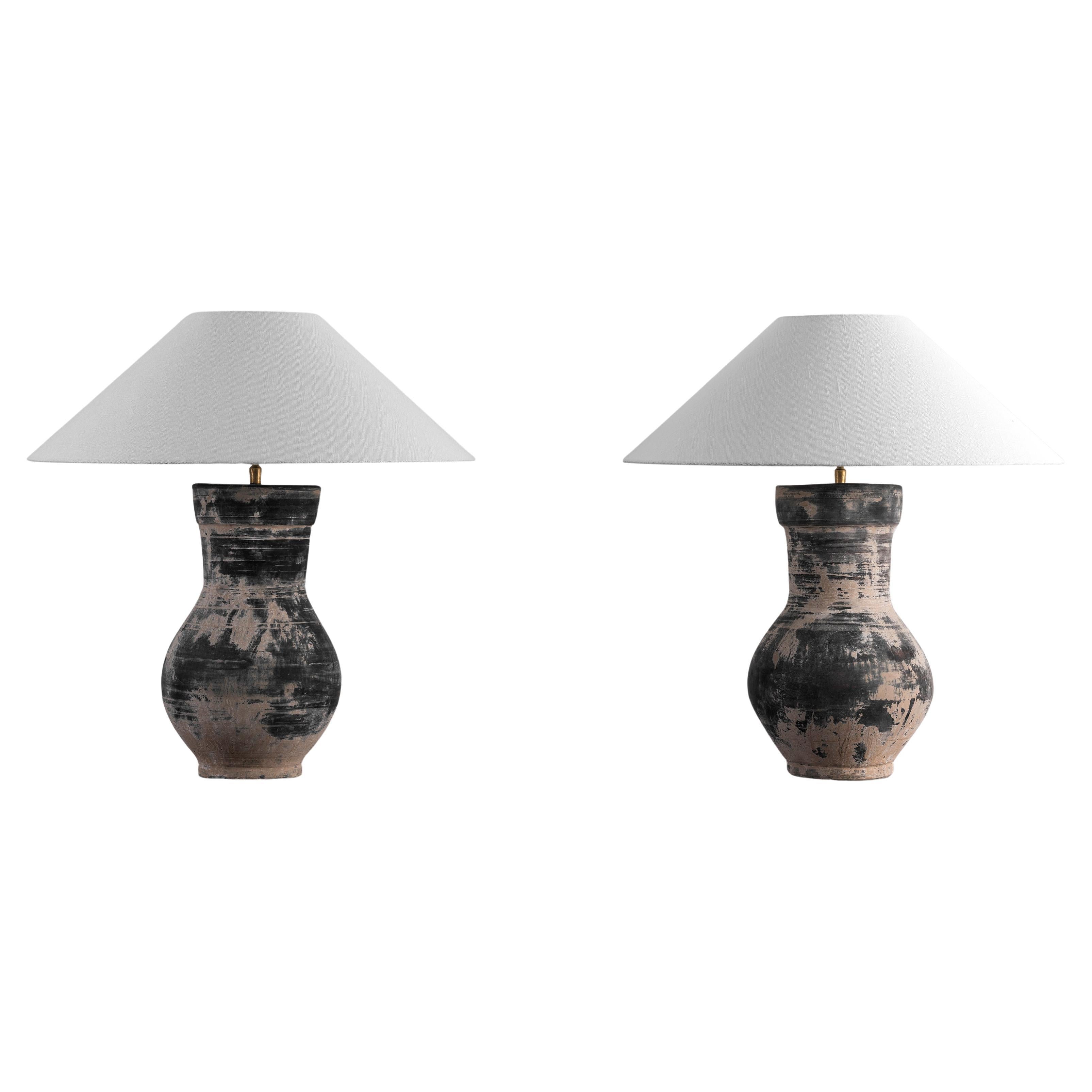 Pair of beautiful unglazed Han dynasty style vase of a very elegant form.
Expectedly mounted as lamp - US WIRED. High quality mount with a brass adjustable pivot joint. Shade handmade in Belgium.
The vase is from Zhejiang, china, mount and shade are
