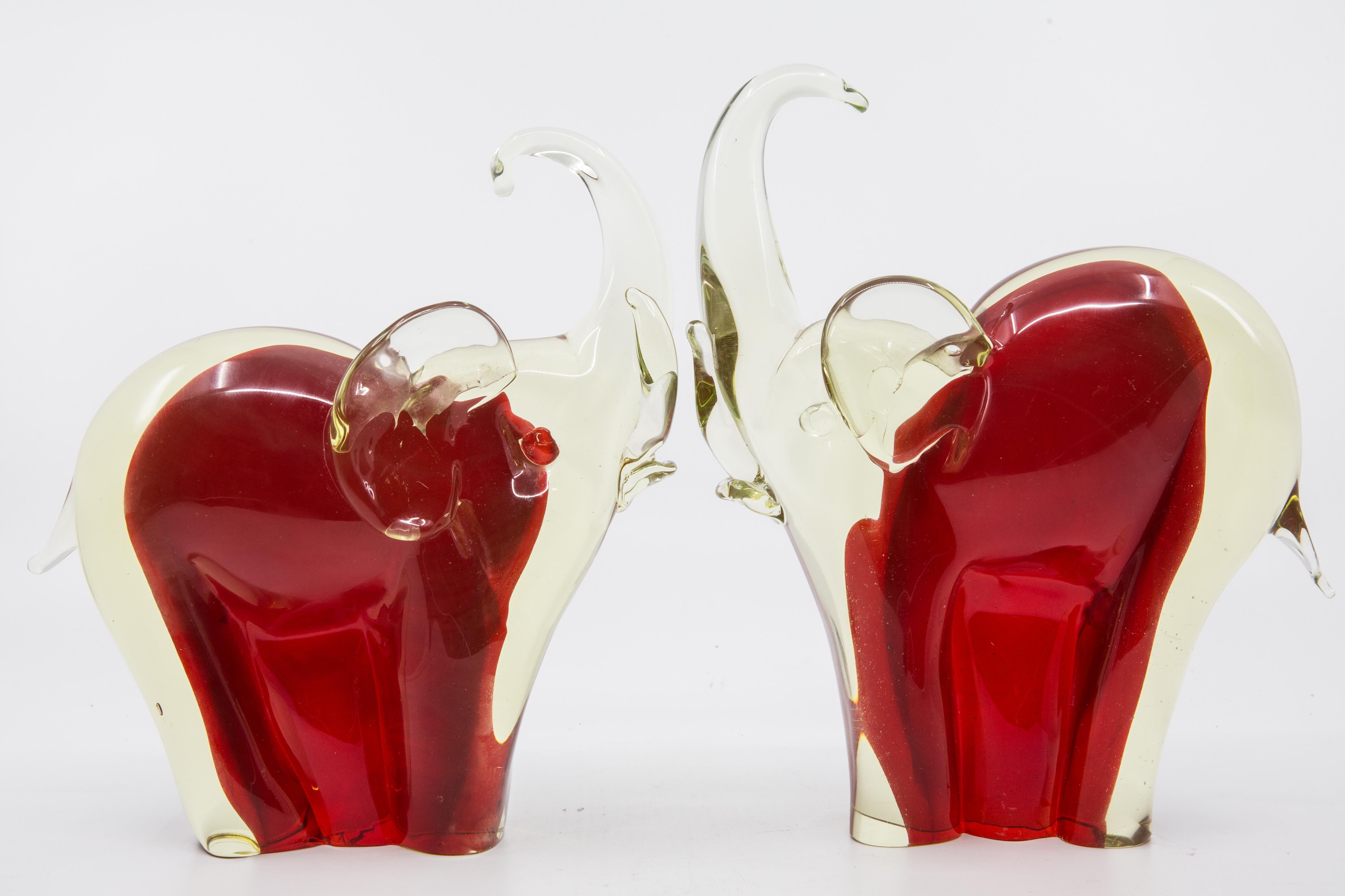 Offered is a Murano glass hand blown pair of elephant sculptures or book-ends. The pair dates from mid-century and measures 9” in height.