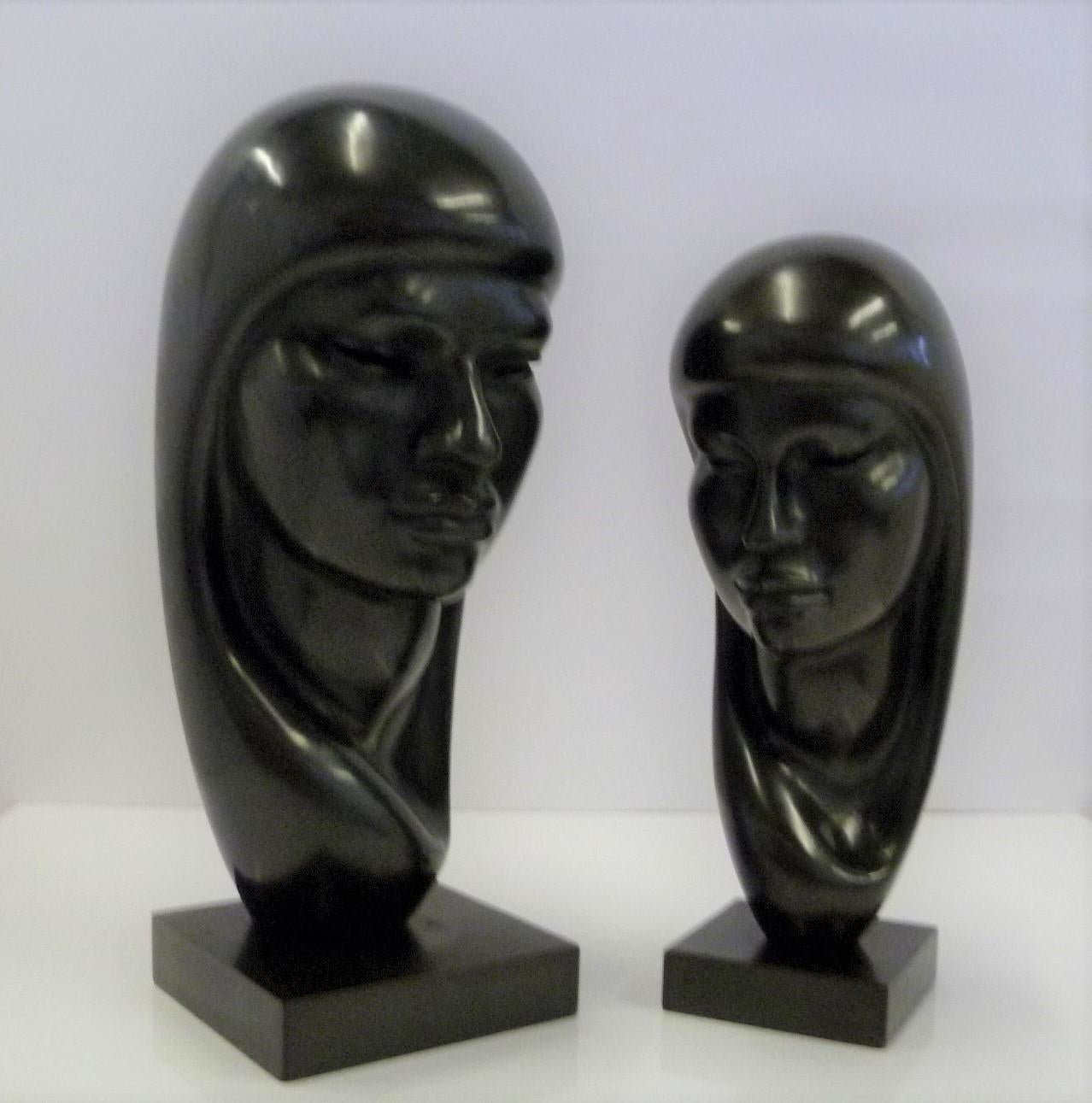 Mid-Century Modern Pair of Hand Carved Ebonized Wood Sculptures of Native Women Signed Arias, 1950s