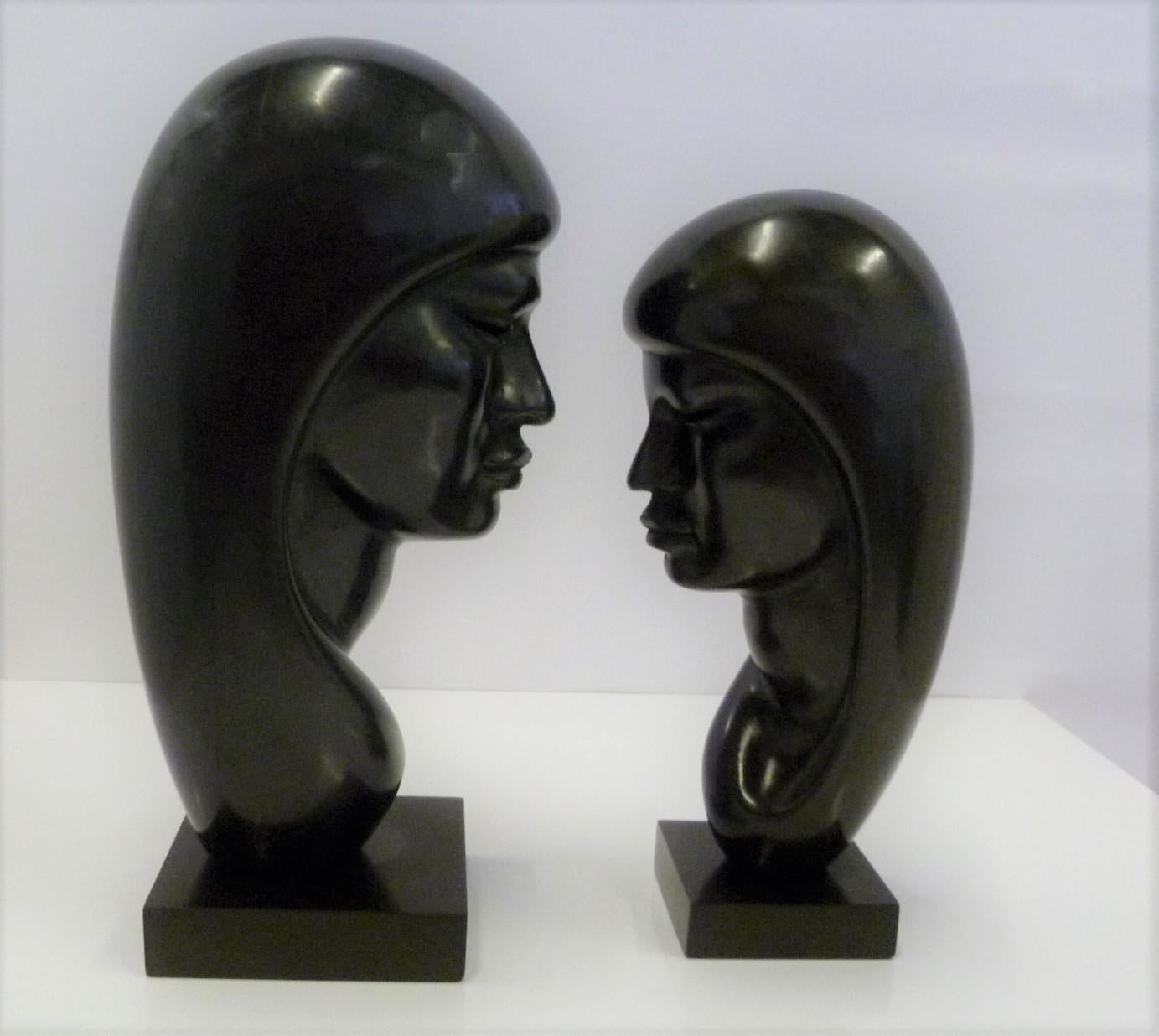 Bolivian Pair of Hand Carved Ebonized Wood Sculptures of Native Women Signed Arias, 1950s