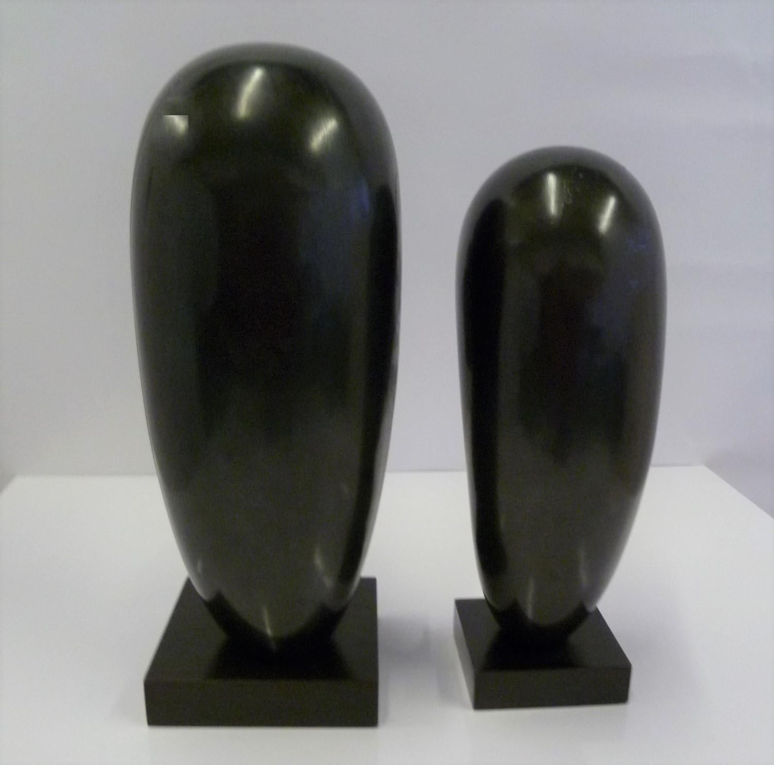 Hand-Carved Pair of Hand Carved Ebonized Wood Sculptures of Native Women Signed Arias, 1950s