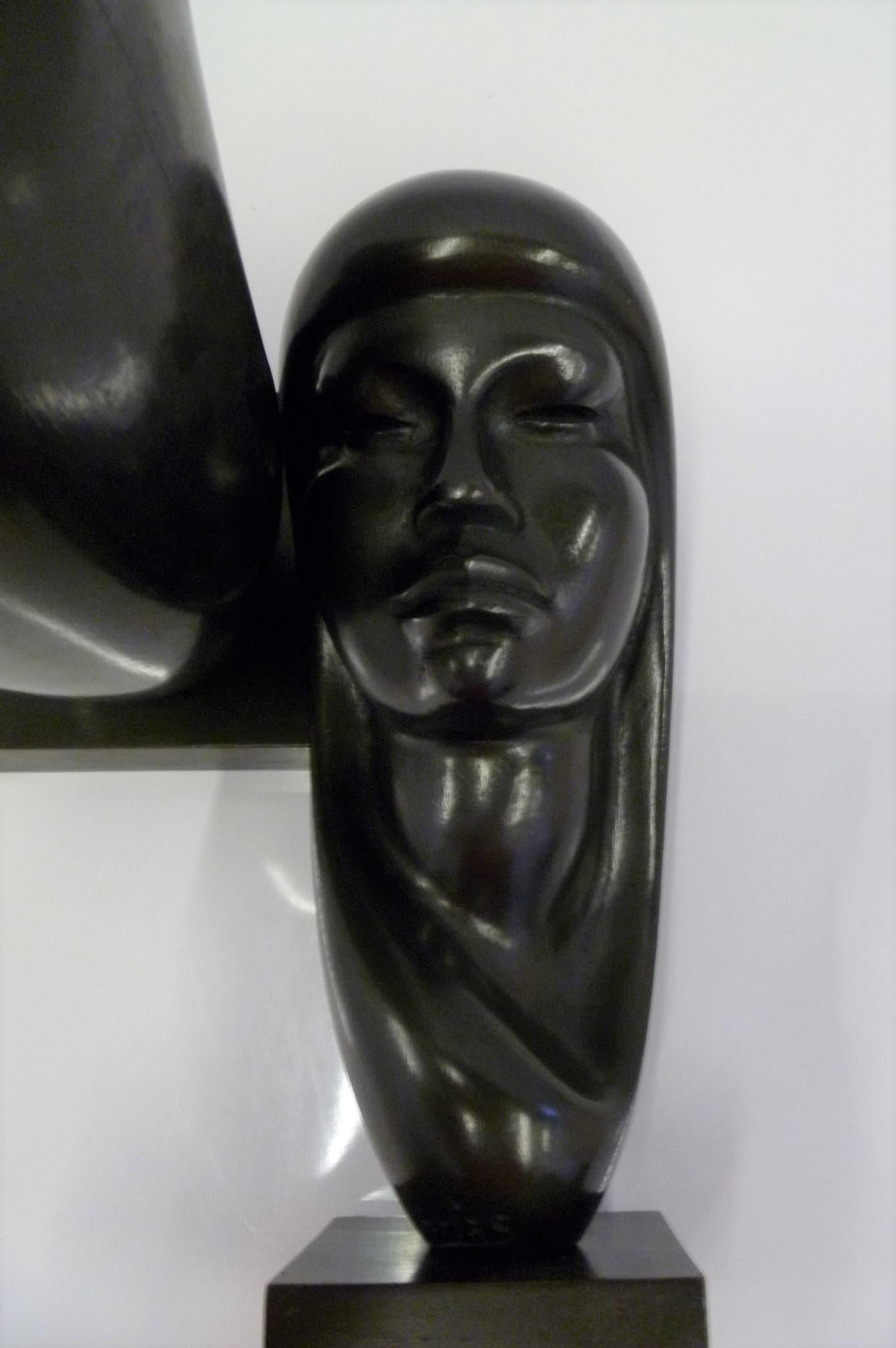 Pair of Hand Carved Ebonized Wood Sculptures of Native Women Signed Arias, 1950s In Good Condition In Miami, FL