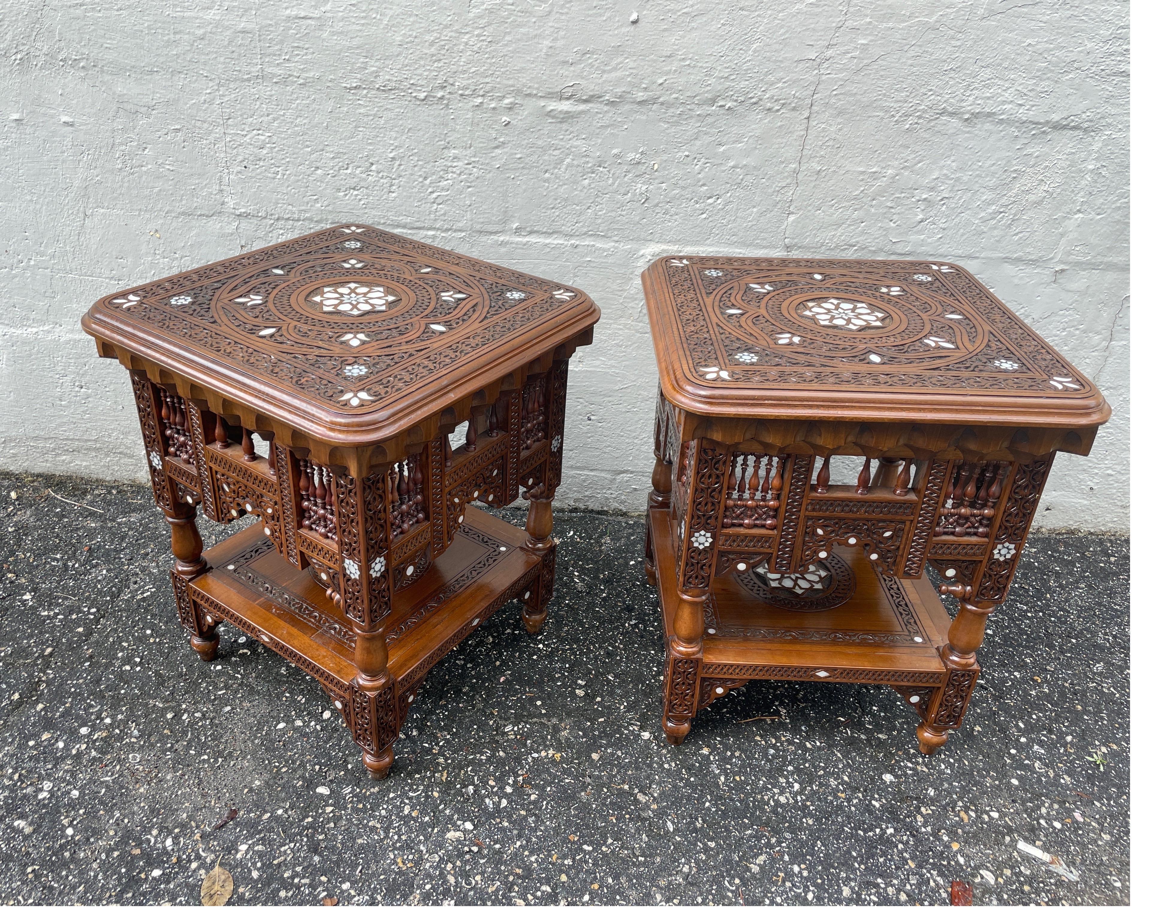 Pair of intricately carved & inlaid mother of pearl side tables. Beautifully detailed on top, bottom & all sides make this pair a real standout in any setting. Very superb quality.
