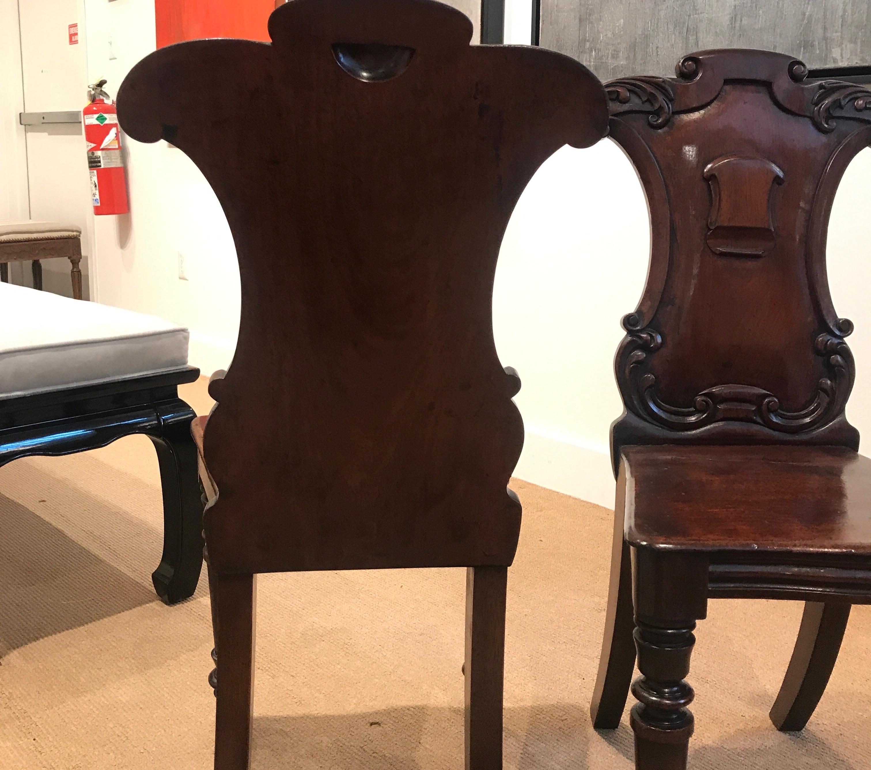 Pair of Hand Carved Mahogany Armorial Hall Chairs For Sale 5