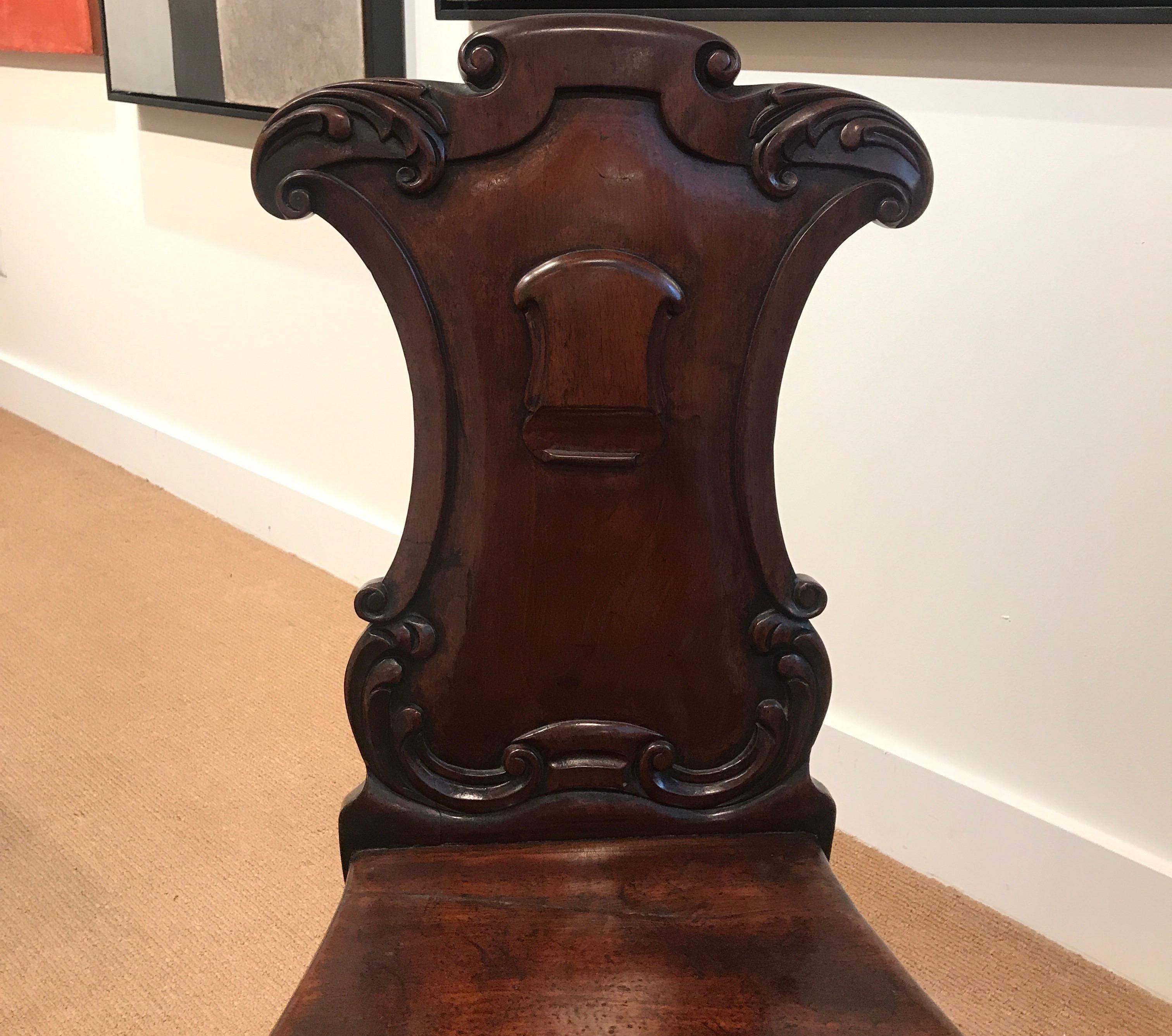 William IV Pair of Hand Carved Mahogany Armorial Hall Chairs For Sale