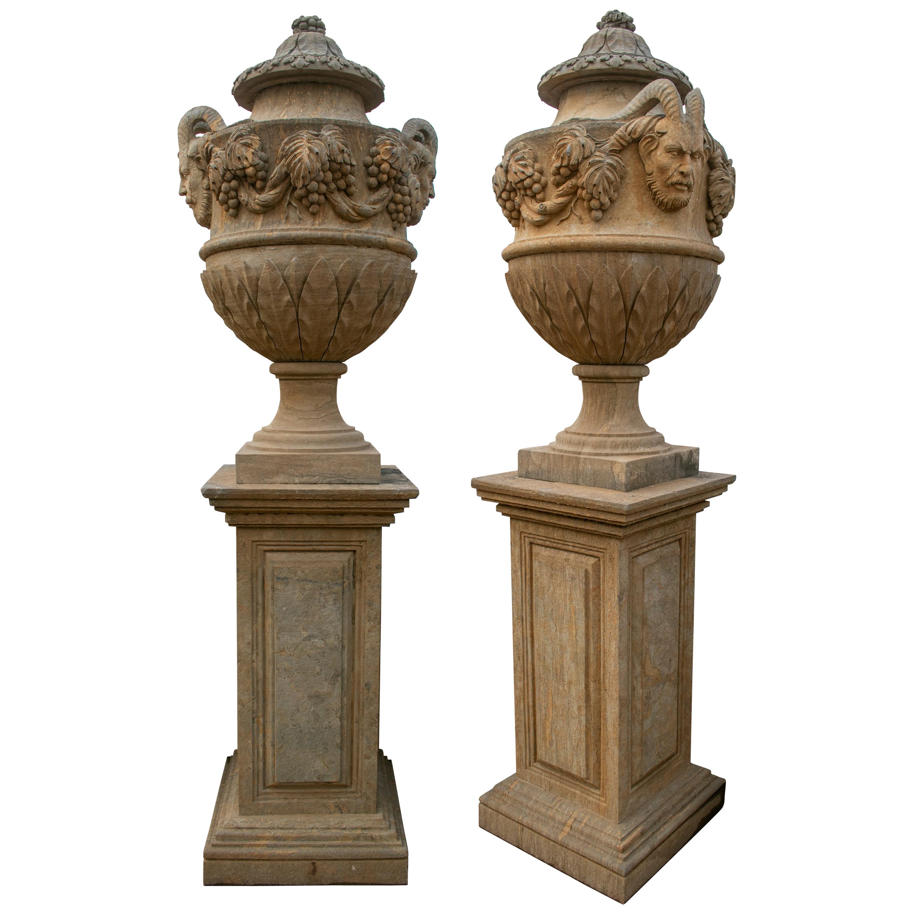 Pair of Hand Carved Marble Urns on Pedestals with Antique Patina