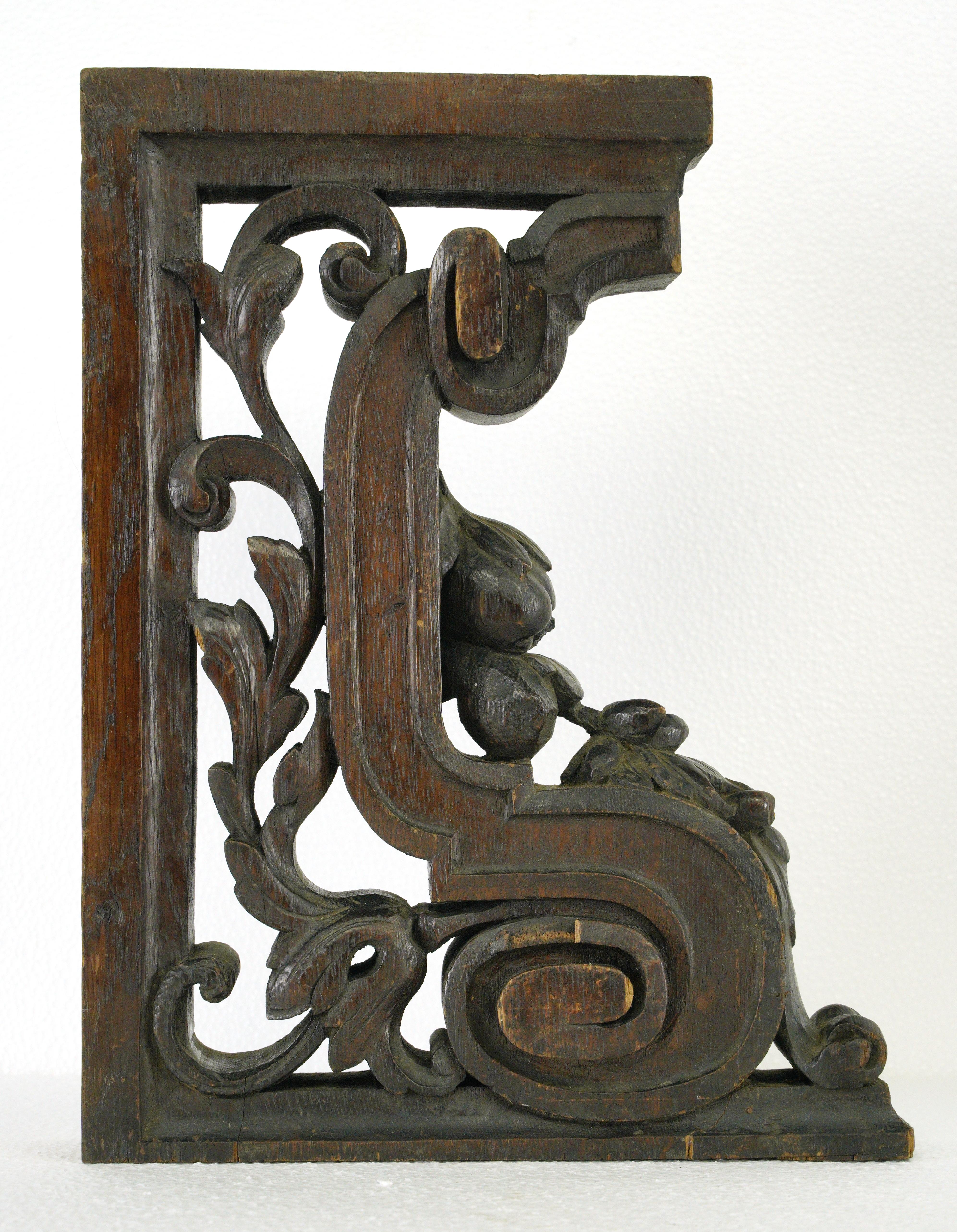 Dark tone solid oak hand carved decorative brackets. Good condition with appropriate wear from age, with one displaying a minor chip and crack. Priced as a pair. Please note, this item is located in our Scranton, PA location.