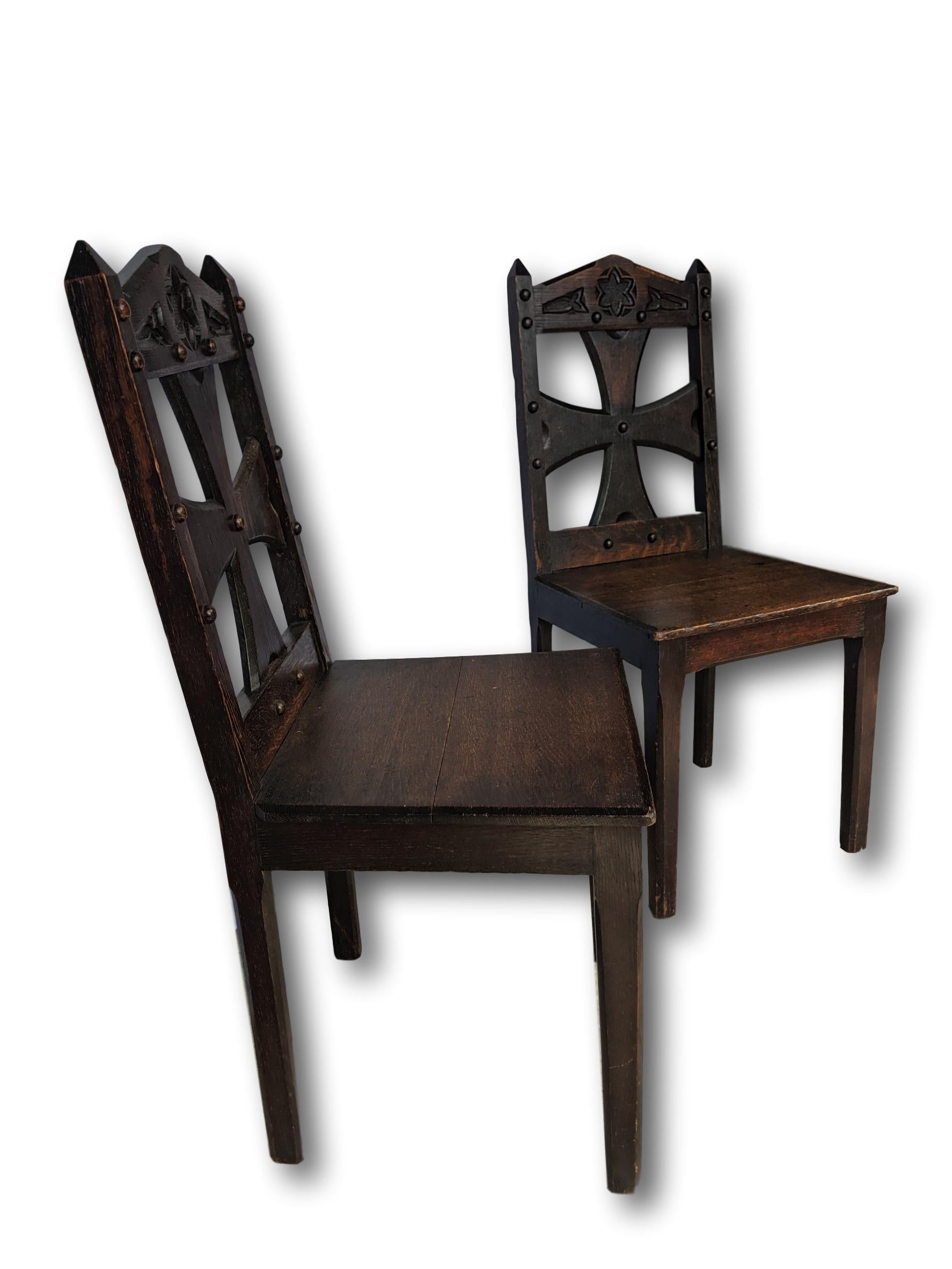 Pair of hand carved oak Gothic chairs, Arts & Crafts movement, Scottish, circa 1880. Highest quality antique chairs with lovely, warm patina. Sturdy and ready for use.
