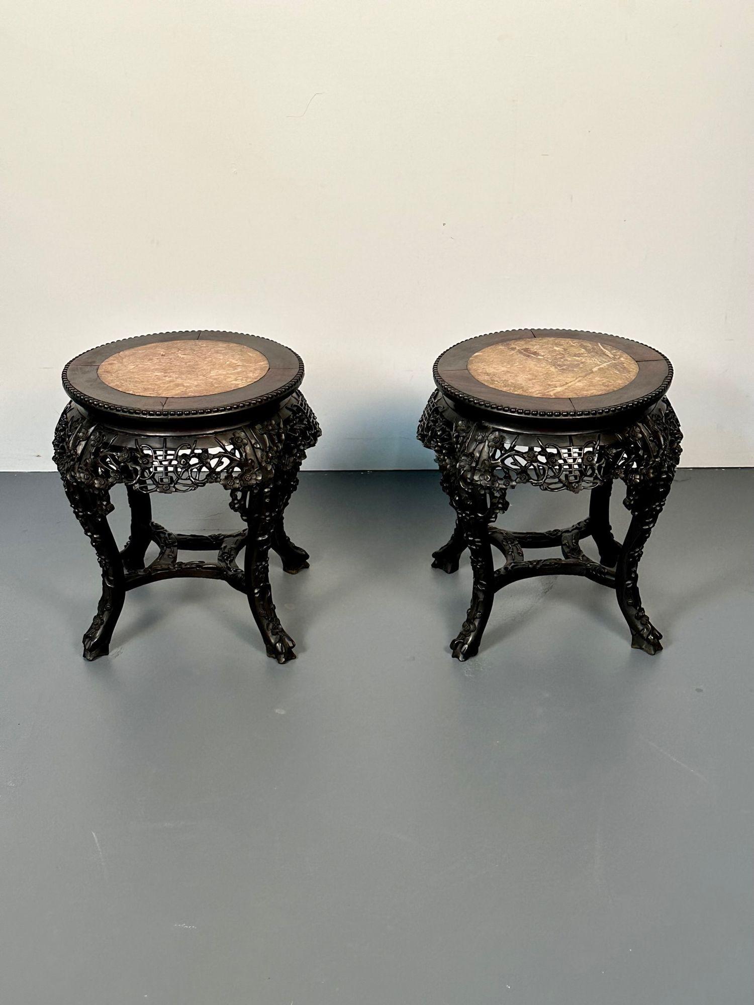 Pair of Hand Carved Oriental Chinese Pedestals / Low Tables, Teak Wood, Marble
 
Pair of ornately carved Chinese low stools or pedestals from the personal collection of iconic American designer, Vladimir Kagan. This pair of pedestals feature