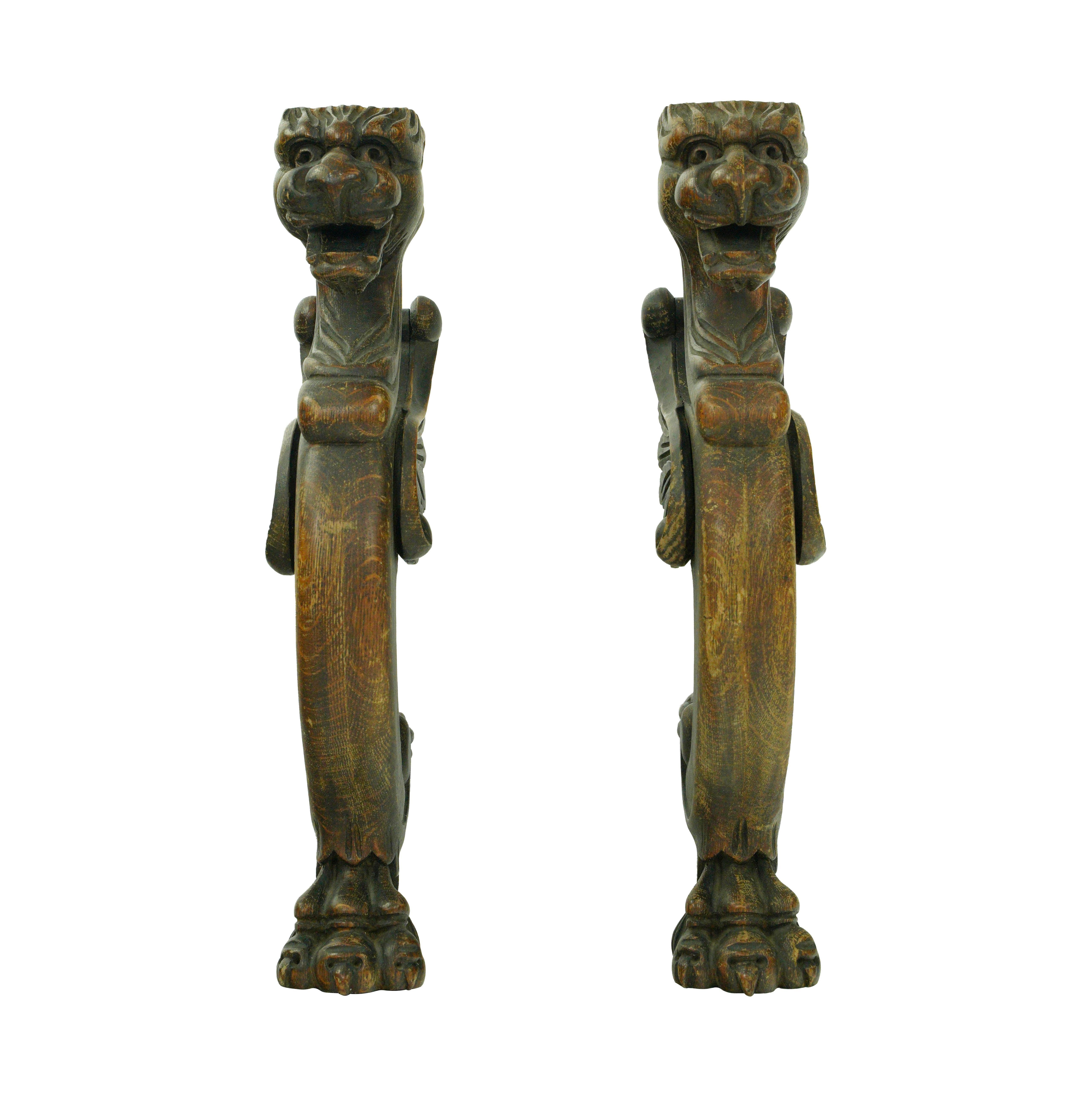 Dark tone solid pine figures carved into griffins. Good condition with appropriate wear from age. Priced as a pair.  Please note, this item is located in our Scranton, PA location.