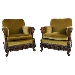 Pair of Hand-Carved Renaissance Revival Lion Head Easy Chairs, c. 1920's